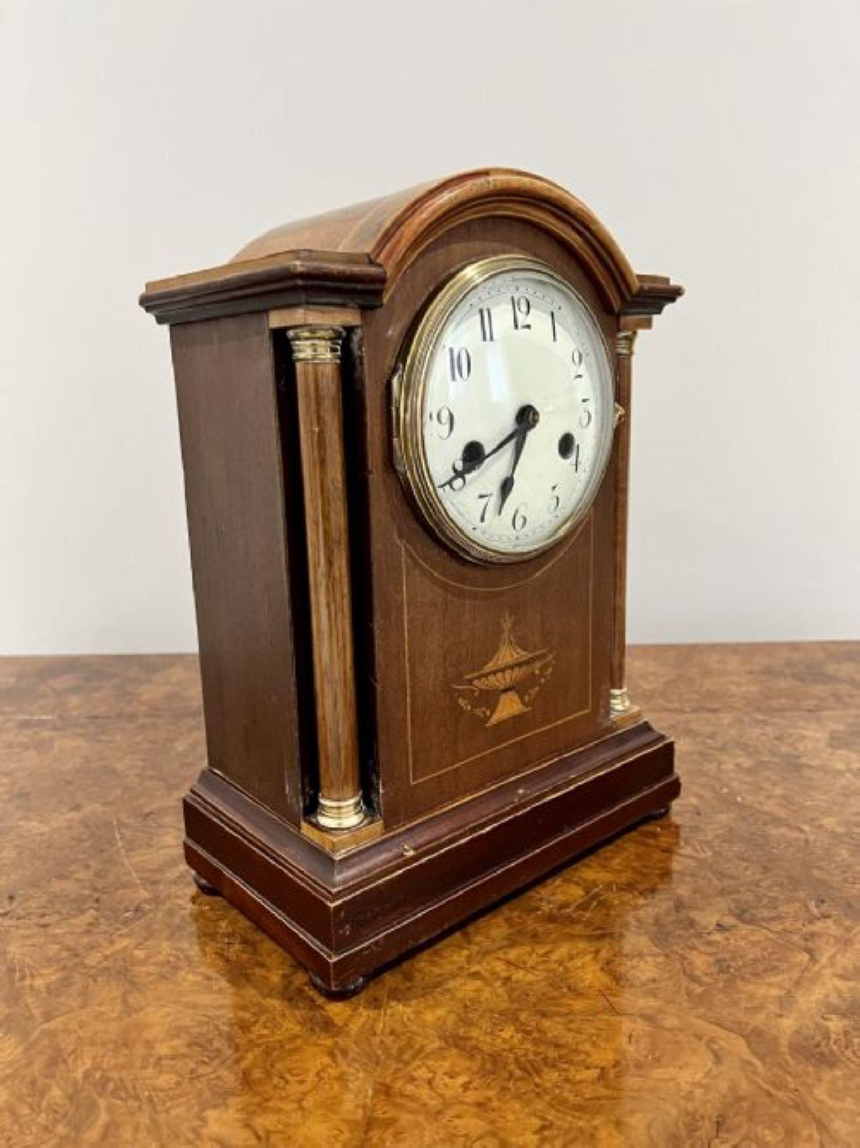 Antique Edwardian quality mahogany inlaid mantle clock having a quality mahogany inlaid case with a brass bezel, circular dial, original hands, 8 day movement striking on the hour and half hour on a gong with the original key
Please note all of our