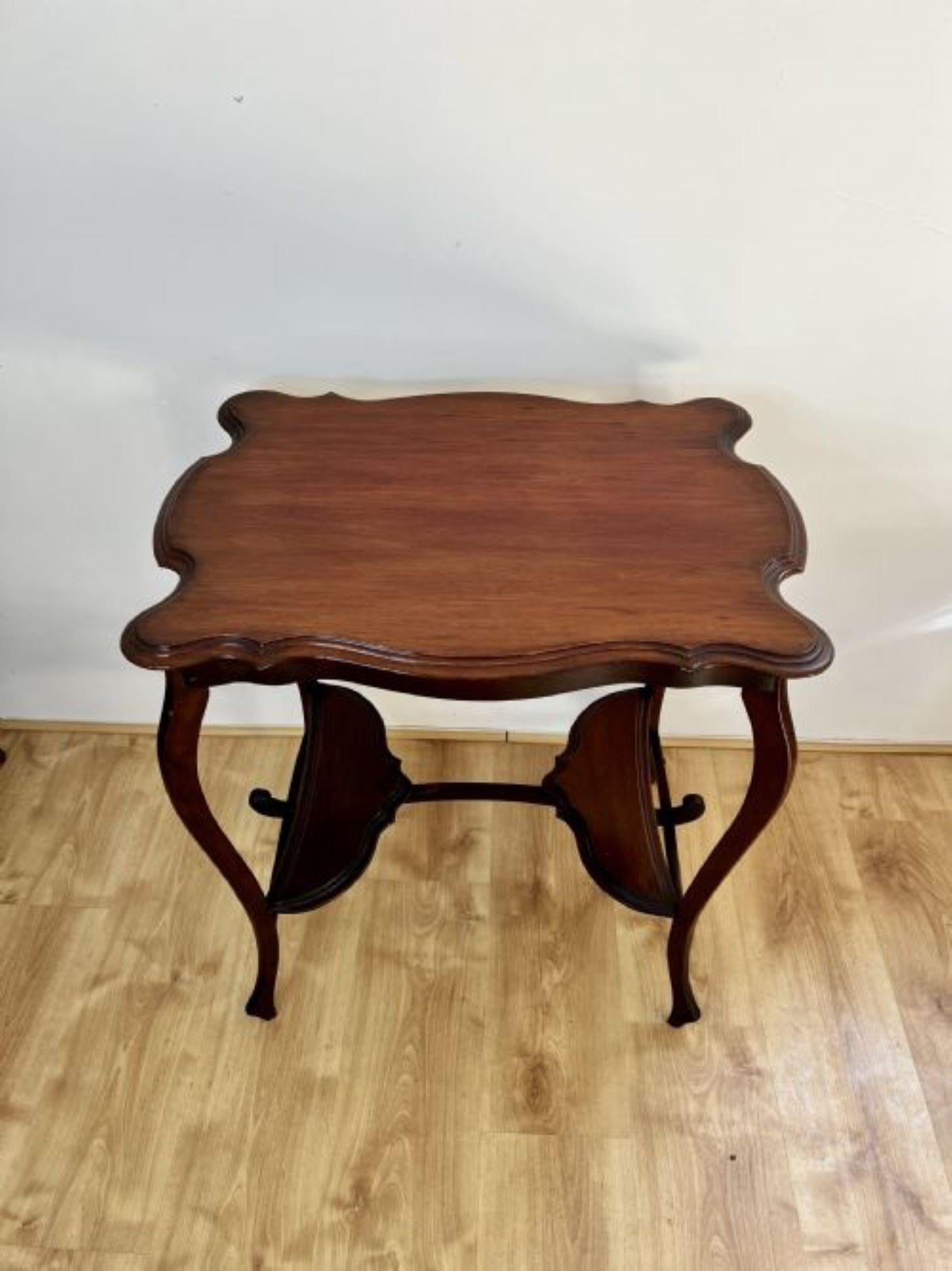 Antique Edwardian quality mahogany lamp table having a quality mahogany shaped top with a moulded edge, standing on shaped cabriole legs united by a shaped undertaker.