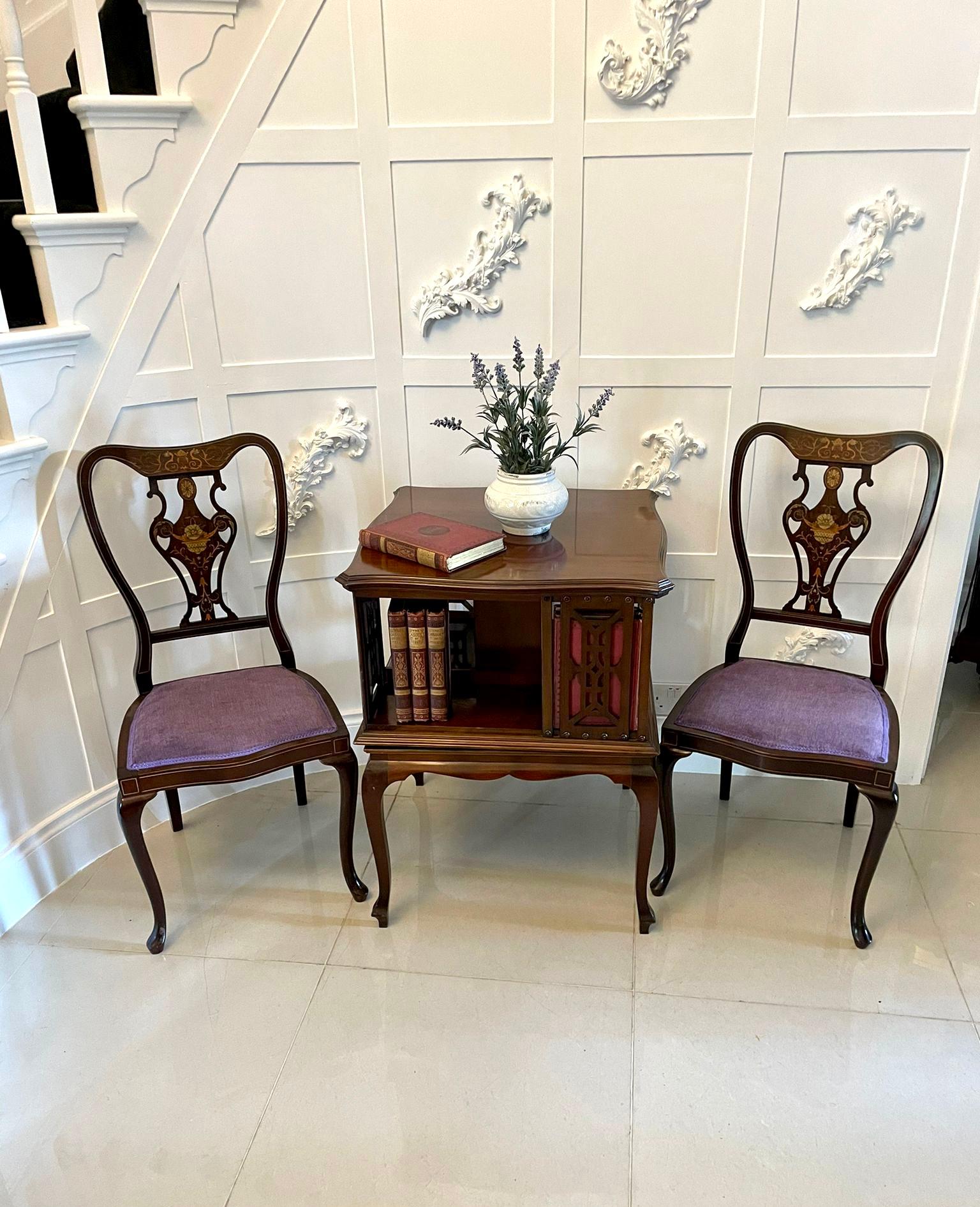 Antique Edwardian quality mahogany revolving bookcase having a quality mahogany serpentine shaped revolving top with a moulded edge above four carved fretwork supports and four storage compartment standing on four mahogany shaped cabriole legs