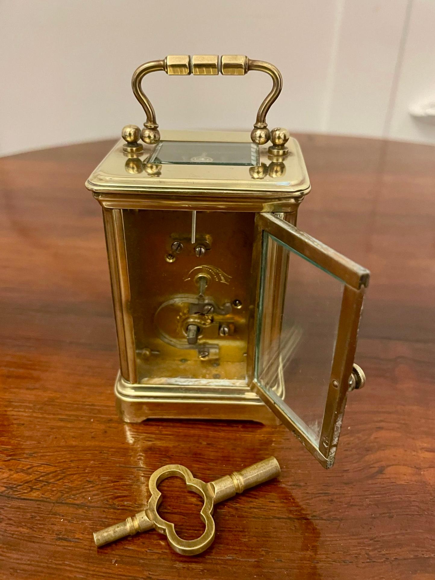 Antique Edwardian quality miniature brass carriage clock by J C Vickery, London having a quality brass case with bevelled edge glass, white enamel dial with original hands, 8 day French movement with original key and in perfect working order


A