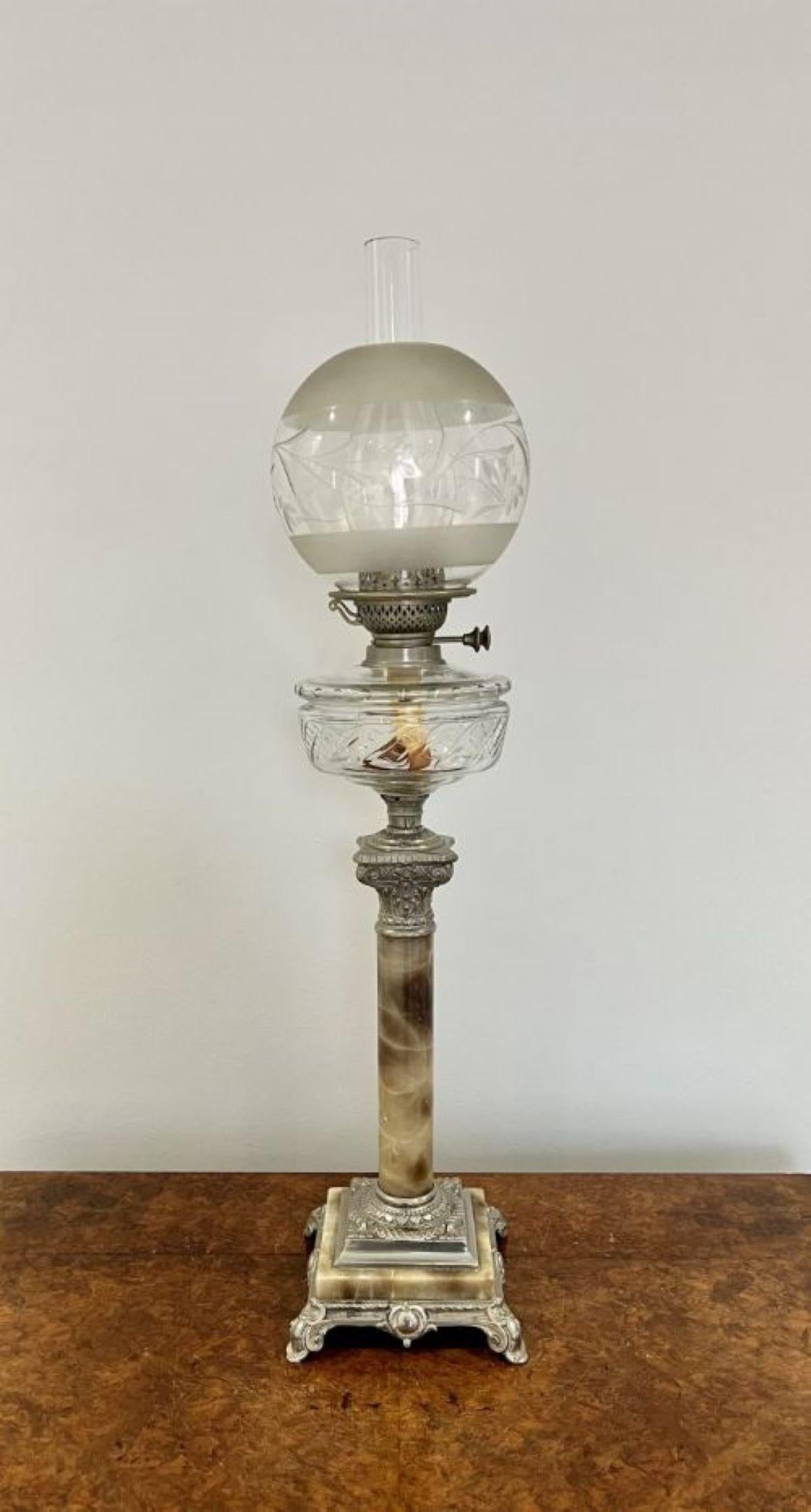Antique Edwardian quality oil lamp having a quality oil lamp with a globular shade above a clear glass font above a corinthian capital column with base metal standing on an ornate stepped square base with scroll feet