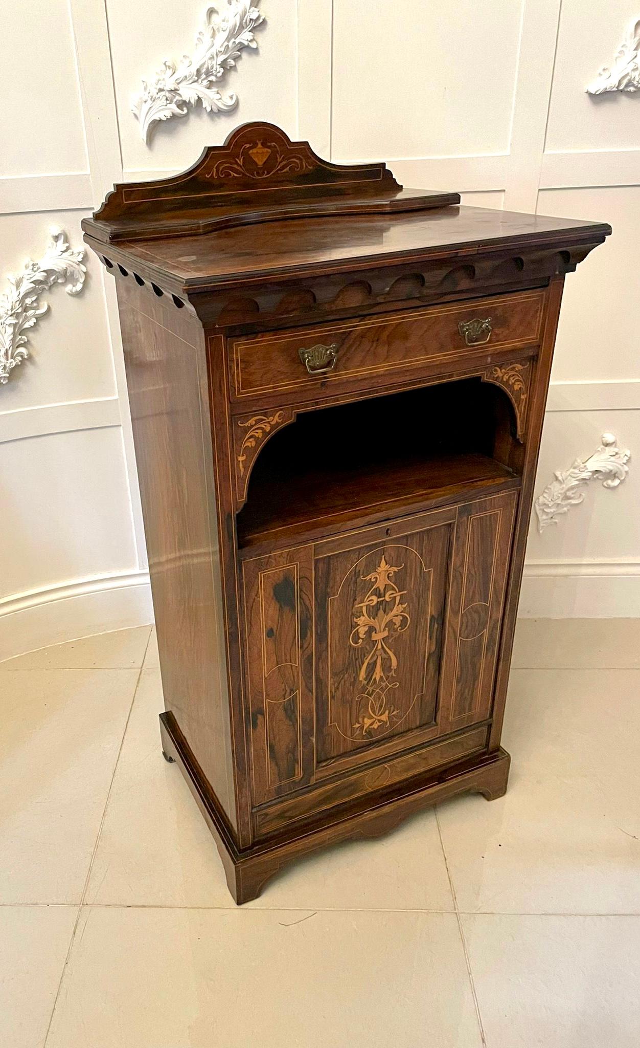 Antique Edwardian quality rosewood inlaid side cabinet having a quality rosewood top with a shaped rosewood inlaid back above a carved frieze, one drawer with pretty original brass handles, shaped supports, drop down front with a quality beautifully