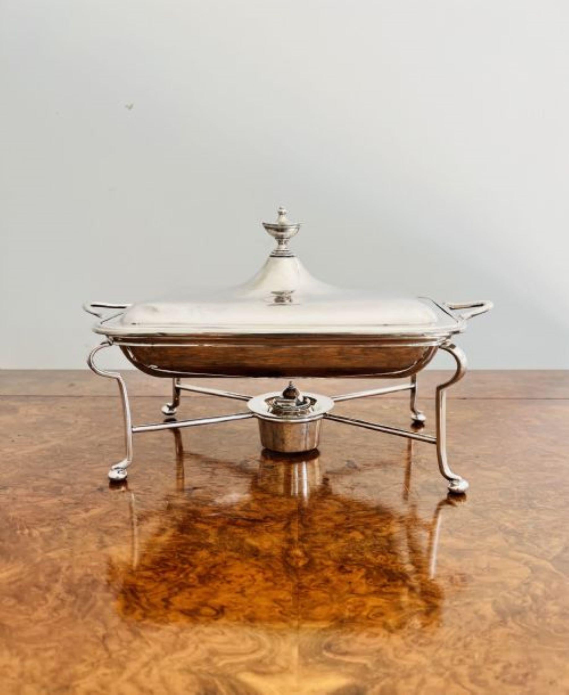 Antique Edwardian quality silver plated entree dish on the original stand having a lift off lid to the entree dish with shaped carrying handles, the stand having shaped legs, crossed stretcher with the original silver plated burner.