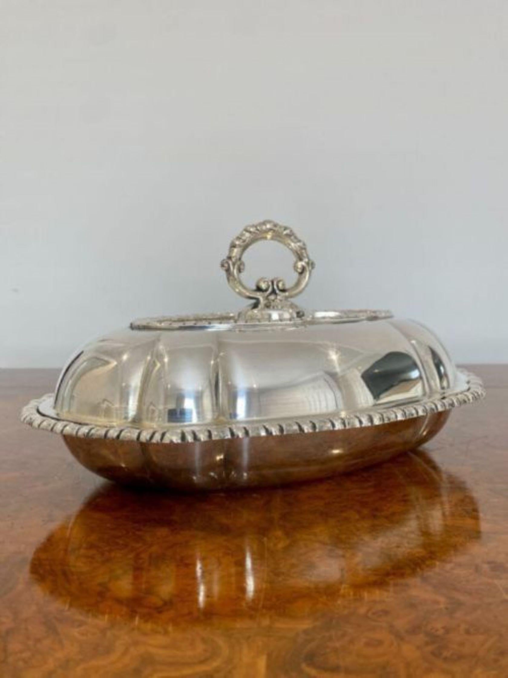 Antique Edwardian quality silver plated oval entrée dish having a quality oval silver plated entrée dish with a lift off lid and removable handle 