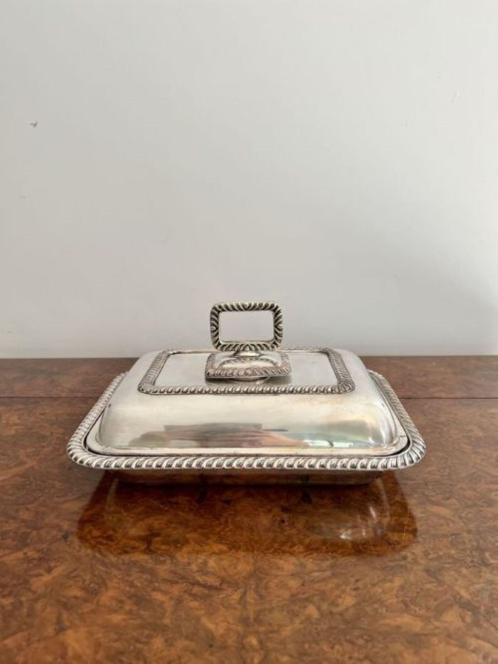 Antique Edwardian quality silver plated rectangle entrée dish having a quality rectangle silver plated entrée dish with ornate detail round the rim, a lift off lid with a silver plated ornate handle to the top.