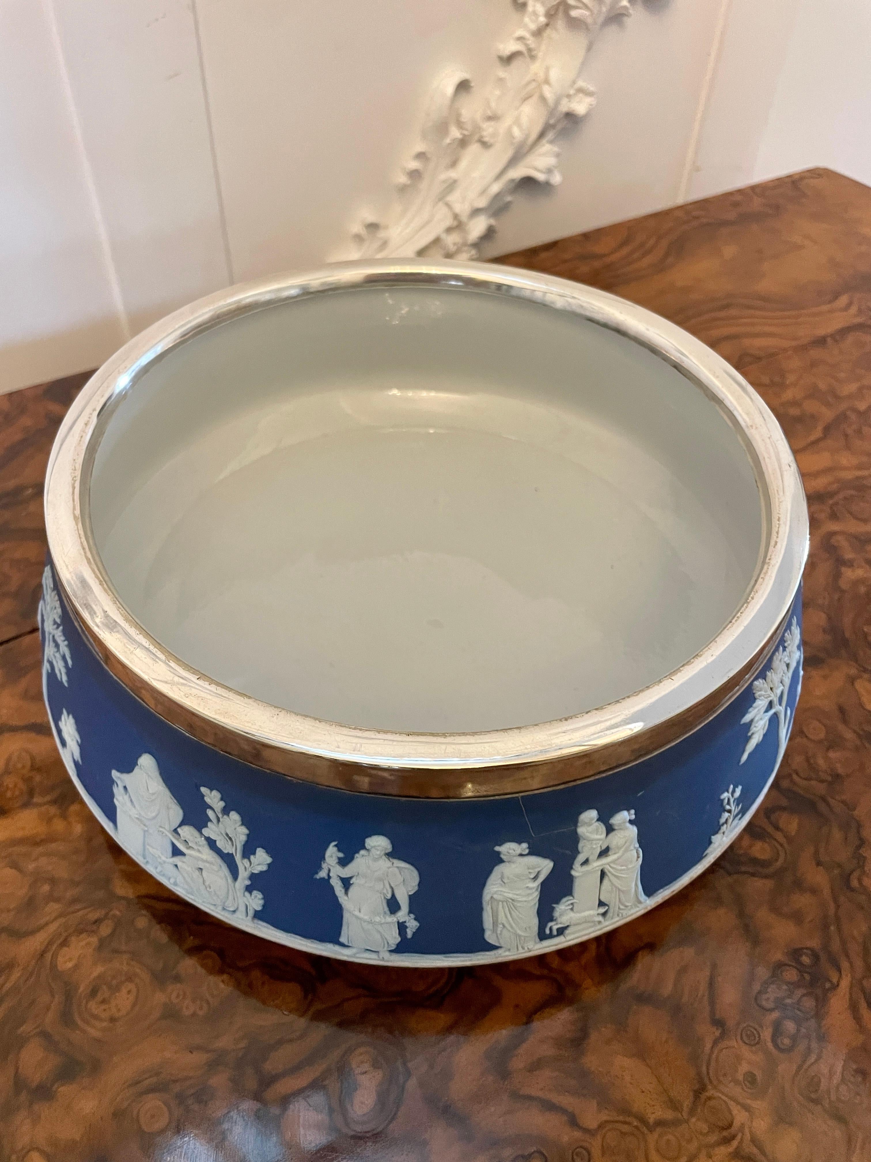 Antique Edwardian quality Wedgwood Jasperware fruit bowl having traditional decoration in wonderful blue and white colours with a circular silver plated rim 


In perfect original condition


Dimensions:
Height 9 cm (3.54 in)
Width 24 cm (9.44