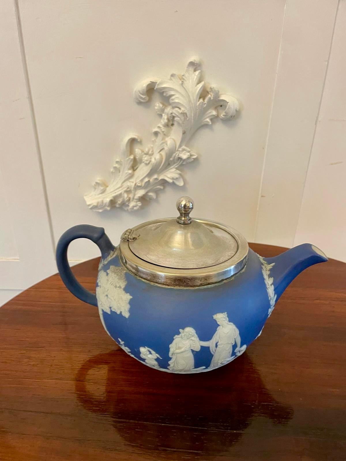 Antique Edwardian quality Wedgwood Jasperware teapot having a quality silver plated lid and rim decorated in the traditional Wedgwood blue and white colours 


In lovely original condition


Sugar bowl is available separately 


Dimensions:
Height