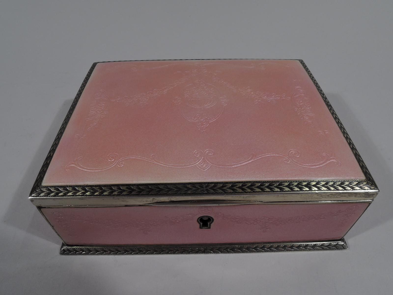 Edwardian Regency gilt sterling silver and pink guilloche enamel box. Made by William B. Kerr in Newark, ca 1910. Rectangular with straight sides and gently curved and hinged cover. Sides and cover top enameled with floral garlands on wavy ground.