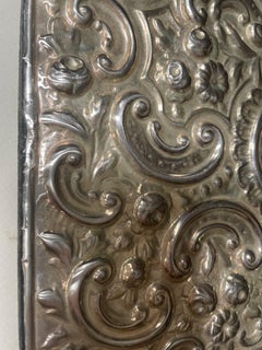 Antique Edwardian Repousse Sterling Silver Bevelled Edge Mirror.