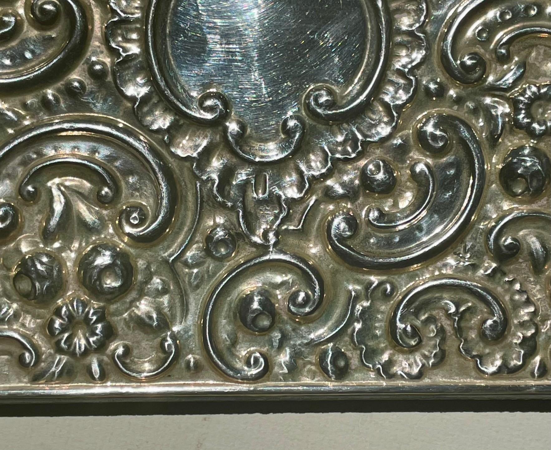 Early 20th Century Antique Edwardian Repousse Sterling Silver Bevelled Edge Mirror. For Sale