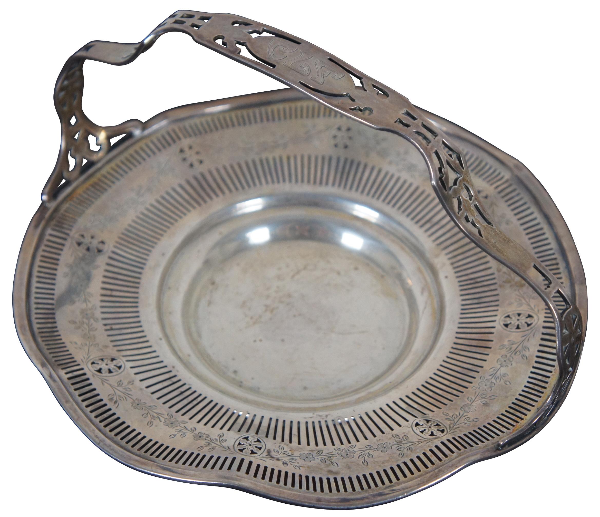 Antique Gorham sterling silver 925 Edwardian style serving basket numbered 2225A with ruffled, reticulated / pierced edge, etched floral designs and monogram CLF on the handle.
 