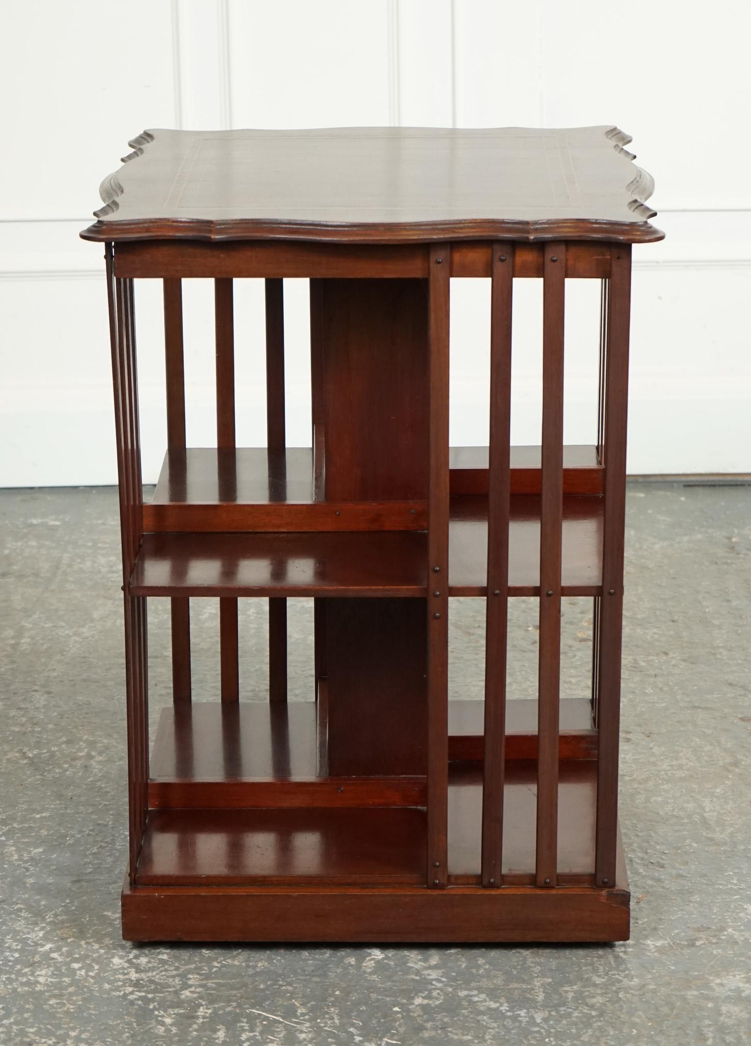 British ANTIQUE EDWARDIAN REVOLVING BOOKCASE WITH A SERPENTiNE SHAPED TOP For Sale