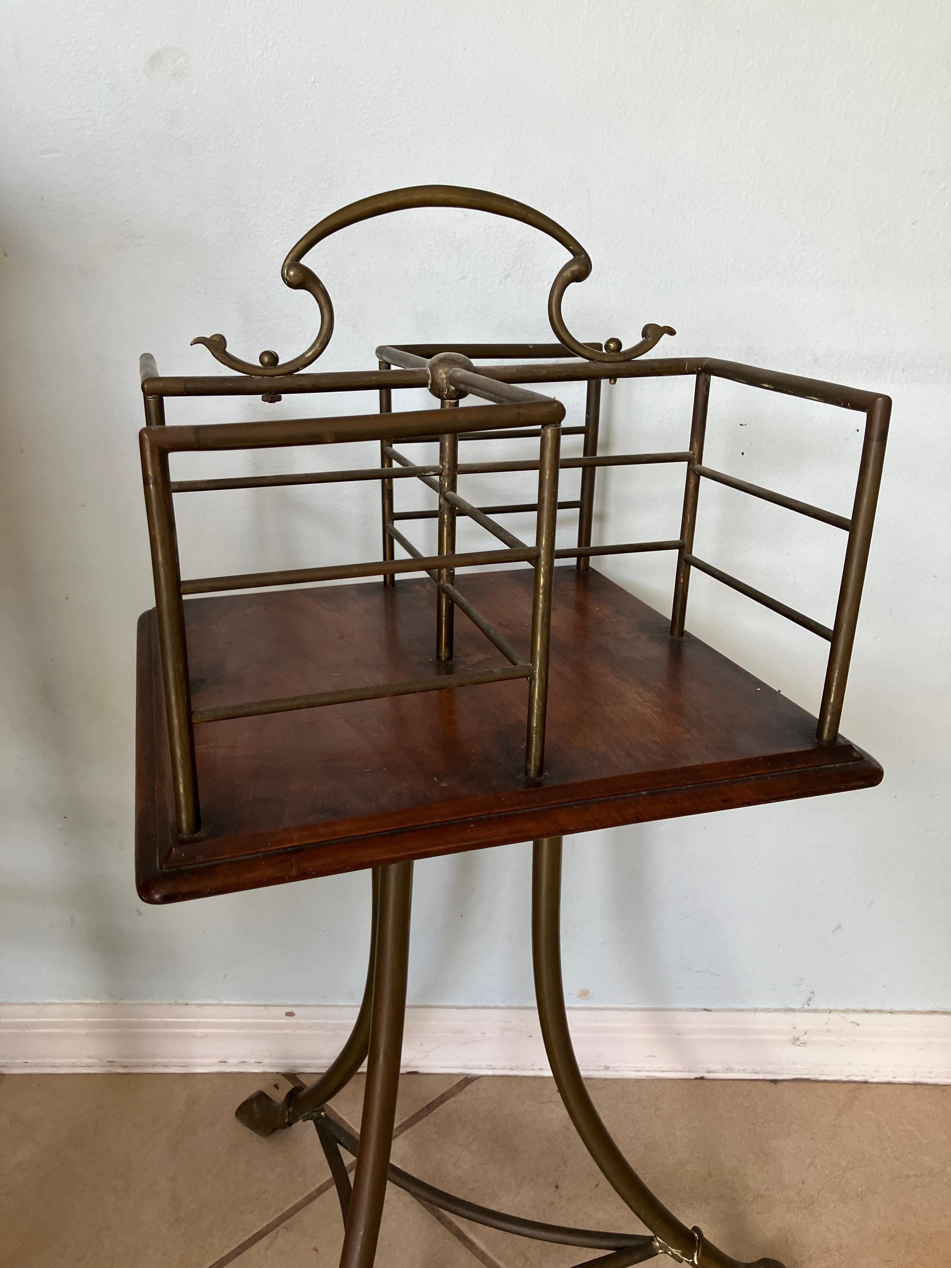 Fabulous Edwardian revolving bookstand. I believe this is from the late 19th century. Beautifully curved legs and feet. I’m not sure what kind of wood. It looks like mahogany. It measures 31 inches high by 19 wide by 19 deep. It looks to be an