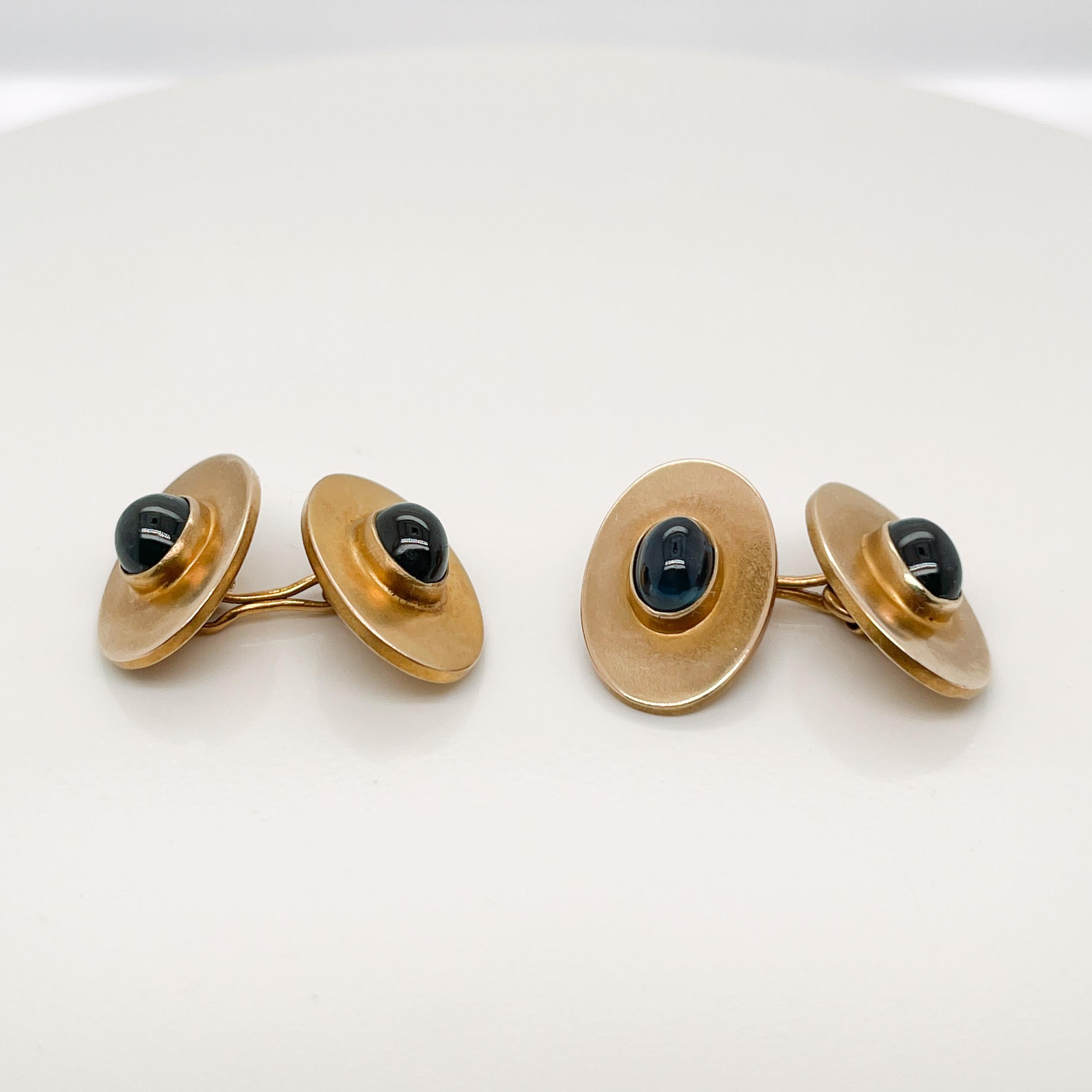 A very fine pair of Riker Bros. gold cufflinks.

With smooth oval sapphire cabochons bezel set in 14k gold ovals.

Simply a wonderful pair of Rikers Bros. cufflinks!

Date:
Late 19th or Early 20th Century

Overall Condition:
They are in overall