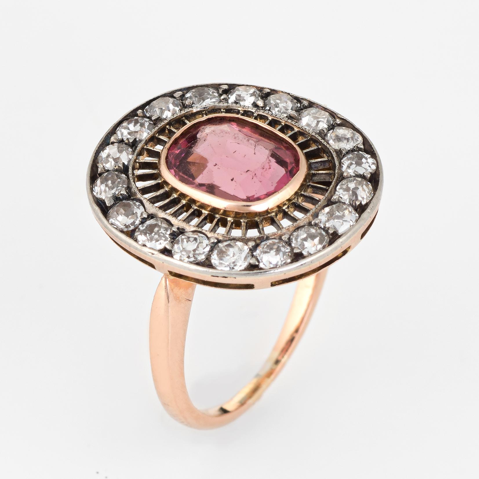 Finely detailed handmade antique Edwardian era pink tourmaline & diamond cocktail ring, crafted in 14 karat rose and white gold. 

One cushion shaped mixed cut tourmaline approx. 2.10 carats (measures 9mm x 7.5mm x 4.35mm), medium pink color, nearly
