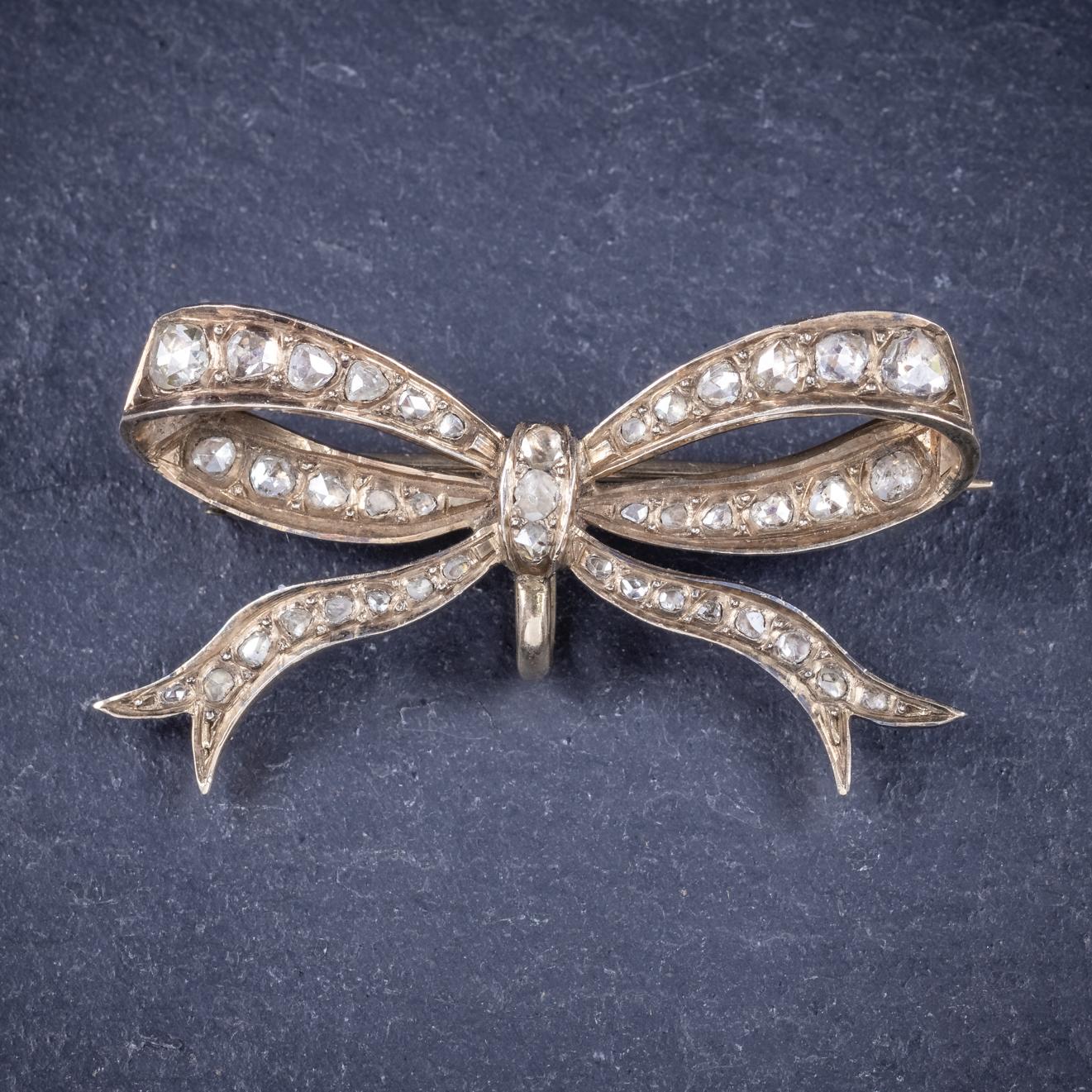 A beautifully made antique Edwardian bow brooch C. 1910, decorated in approx. 1.70ct of Rose cut Diamonds which sparkle throughout the piece. 

The brooch displays beautiful workmanship throughout and fashioned in 18ct Yellow Gold with a sturdy pin