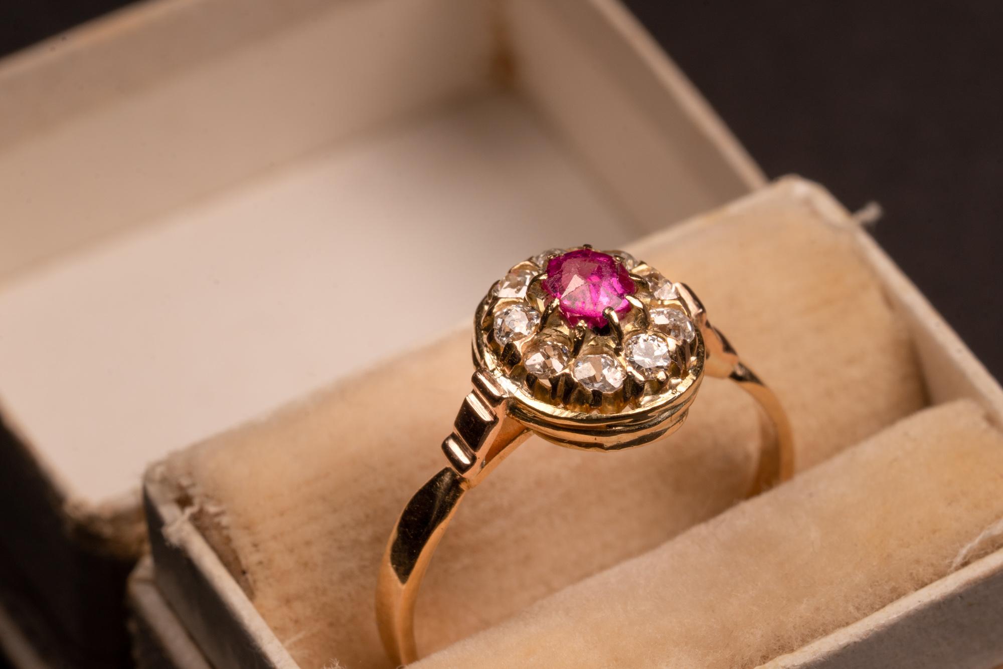 The delicate thin 18 kt gold ring with bright clear ruby, surrounded by a single row of 9 round diamonds will surely attract attention! This antique Edwardian era ring from the early 1900s is a great gift for anniversary or St.Valentines day.