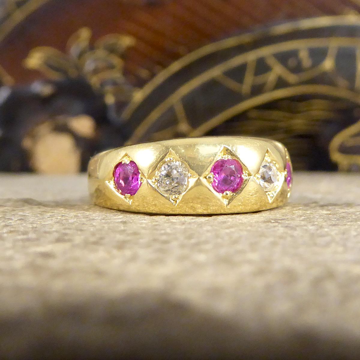This antique ring was crafted in the Edwardian era. It features clear hallmarks on the inner band showing it was crafted in 1909 in London England. The Rubies are bright and beautiful in colour with an even colour distribution, with Diamonds that