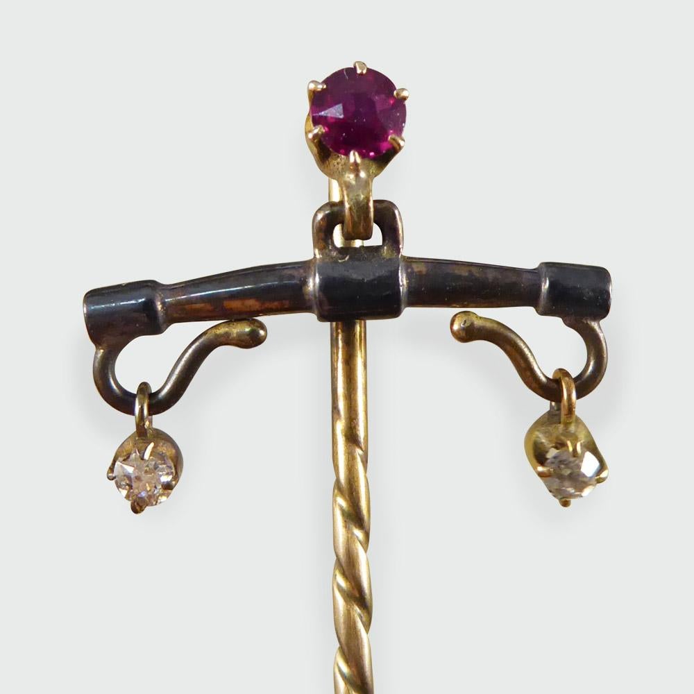 This pretty antique pin was made in the Edwardian era. It features a single ruby with two hanging diamonds, and moves freely when worn!

Condition: Very Good, slightest signs of wear due to age and use
Defects: None
Date / Period: Edwardian
Weight: