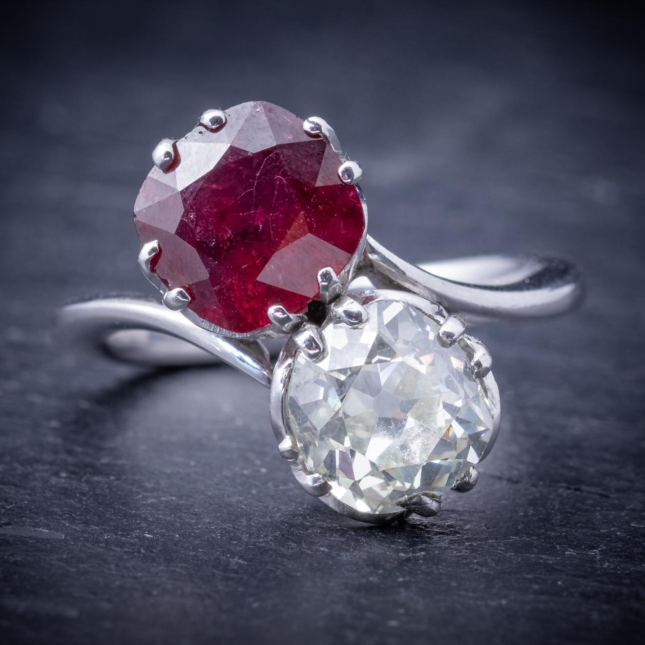 A stunning antique Edwardian ring C. 1915, adorned with a beautiful 2.50ct Ruby and accompanied by a 2.35ct old cut Diamond. 

The Diamond is a wonderful SI1 clarity – I colour stone and compliments the dark red Ruby beautifully. 

The gallery is