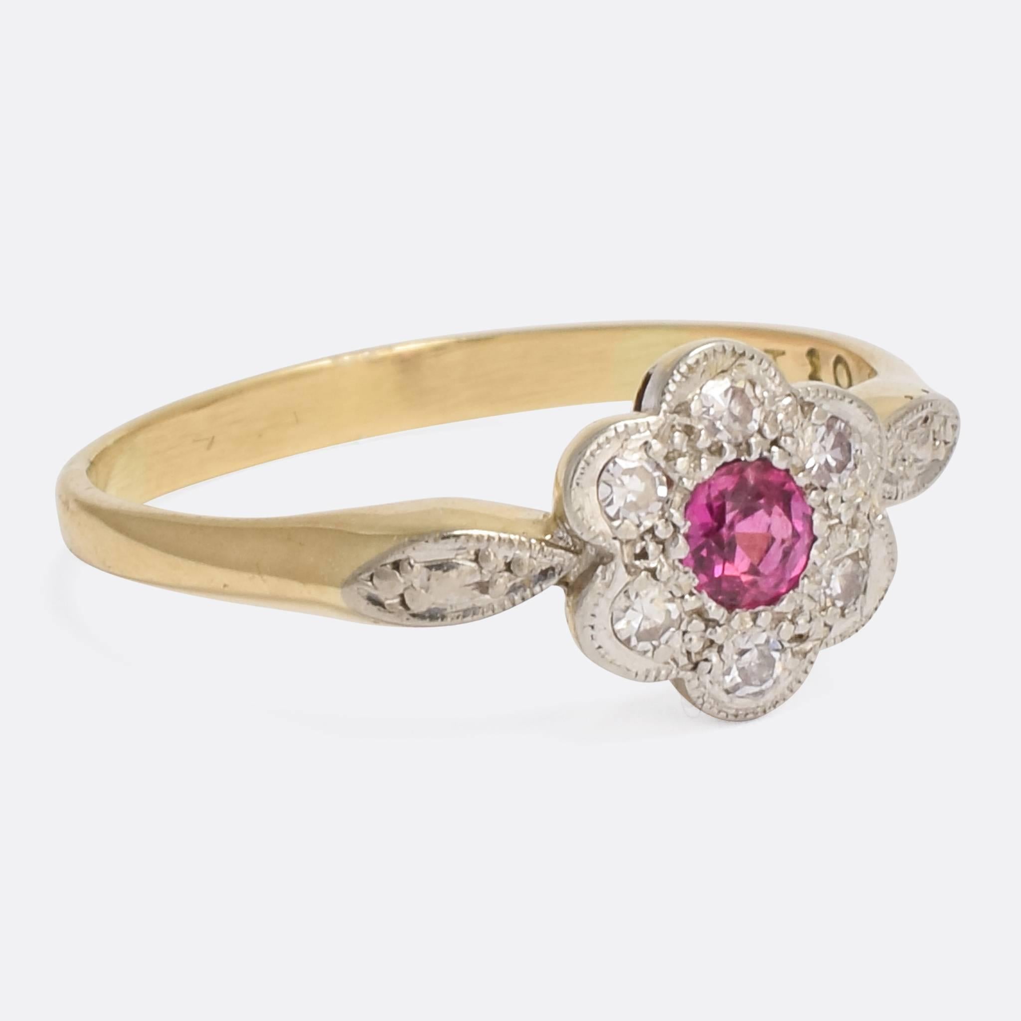 A sweet antique flower cluster ring, modelled in 18k gold with platinum tipped head. It's set with a central ruby, surrounded by six white diamonds. Finished in fine millegrain, with prominent platinum shoulder accents.

STONES
Natural Ruby (3.1mm)