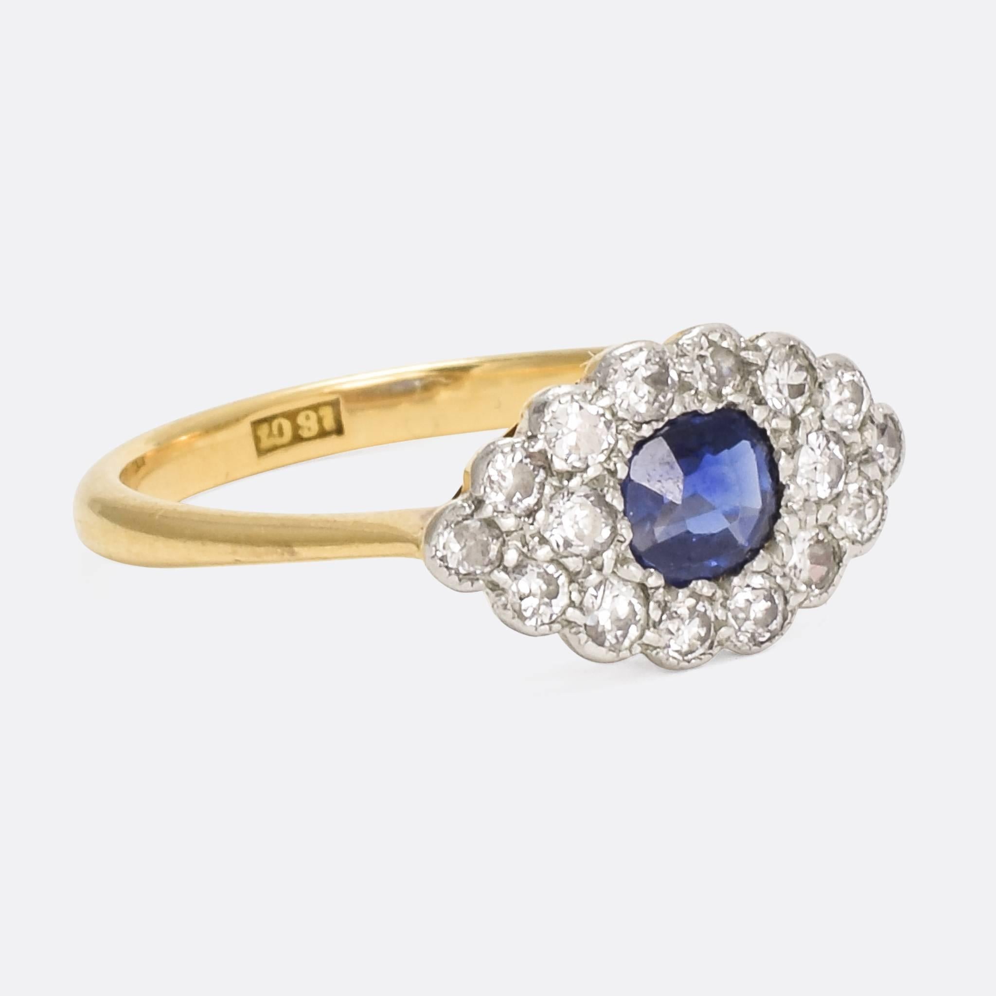 A wonderful Blue Sapphire & Old Cut Diamond Eye Ring dating from the Edwardian era, circa 1910. It's modelled in 18 karat yellow gold with platinum settings, very typical of the period, and features a fine pierced gallery. The piece has a clear 18ct