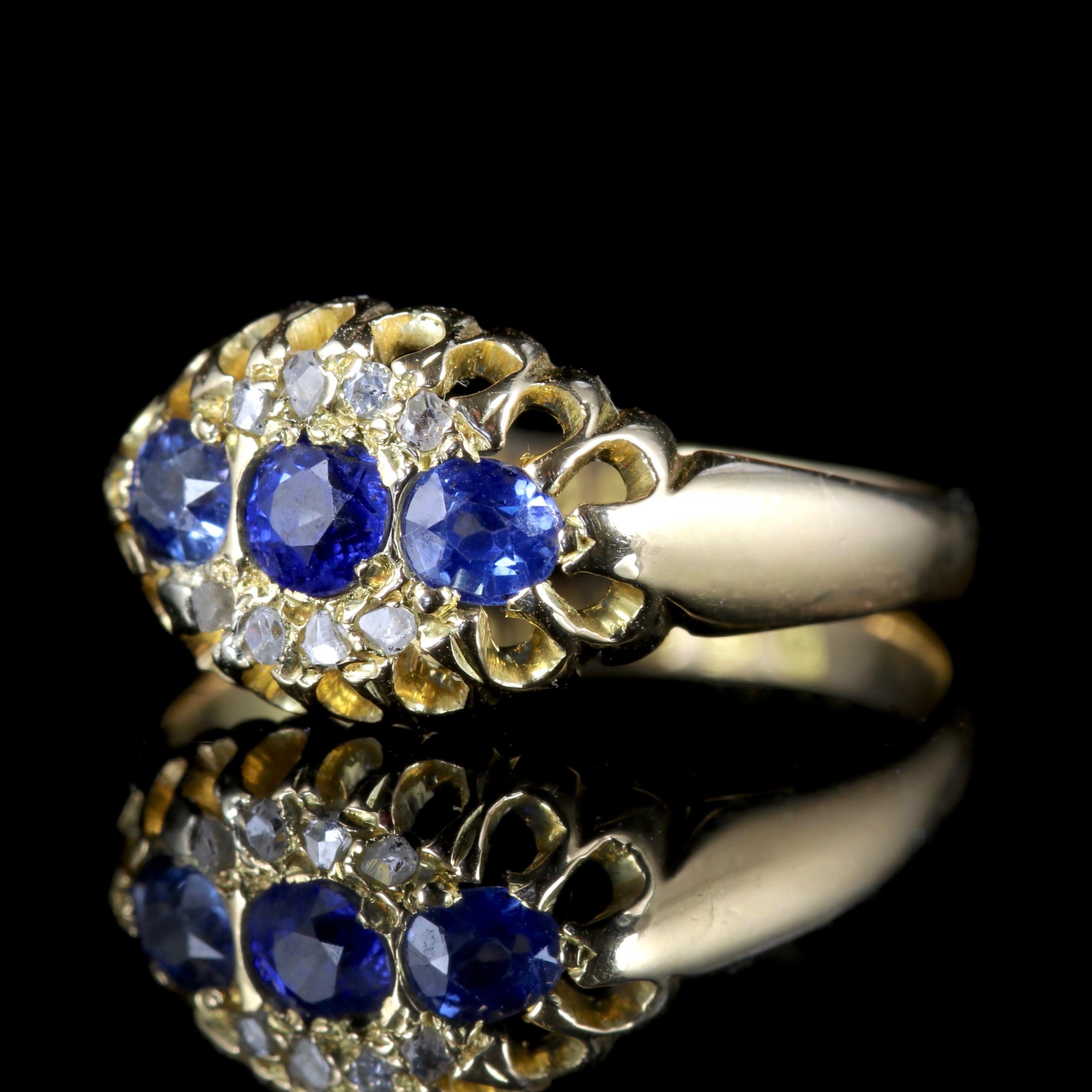 This beautiful Edwardian 18ct Yellow Gold Sapphire and Diamond ring is fully hallmarked, Chester 1903.

A trilogy of Sapphires are set across the central gallery with a halo of Diamonds surrounding them. 

Trilogy means past, present and future or