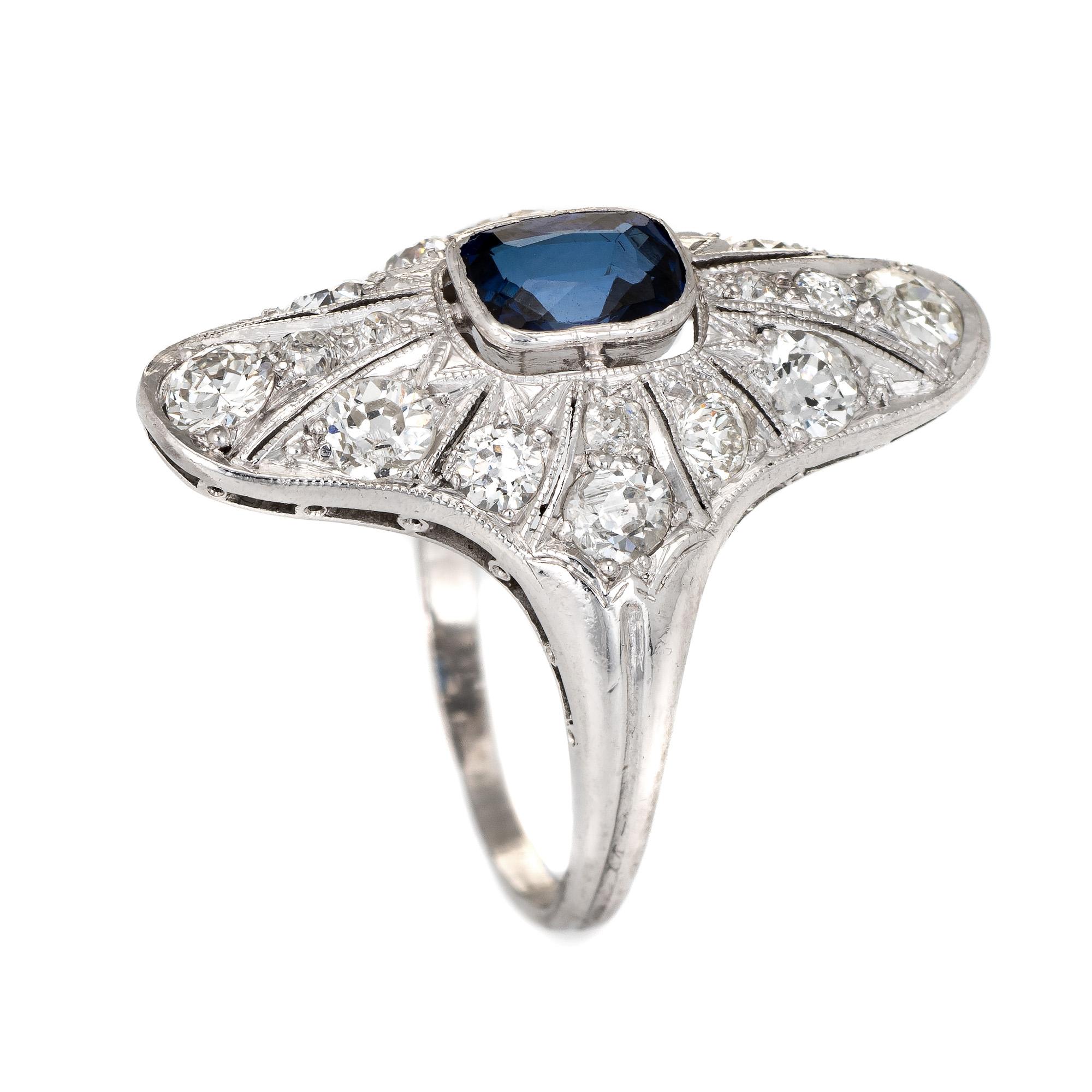 Finely detailed antique Edwardian era ring (circa 1910s) crafted in 900 platinum. 

Centrally mounted estimated 0.50 carat cushion cut blue sapphire is accented with an estimated 1.42 carats of old mine and single cut diamonds (estimated at I-J