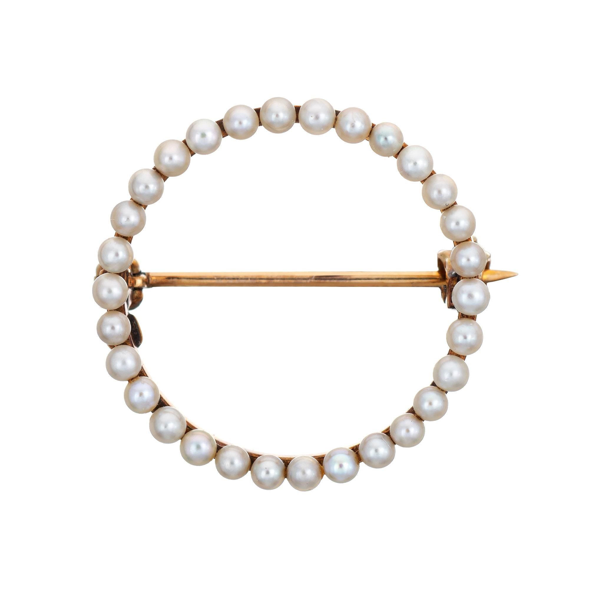 Finely detailed antique Edwardian era brooch (circa 1900s to 1910s), crafted in 14 karat yellow gold.

31 seed pearls each measure 2mm. The pearls are well matching and show rose over tones.
 
The sweet circle brooch measures 3/4 inch diameter.