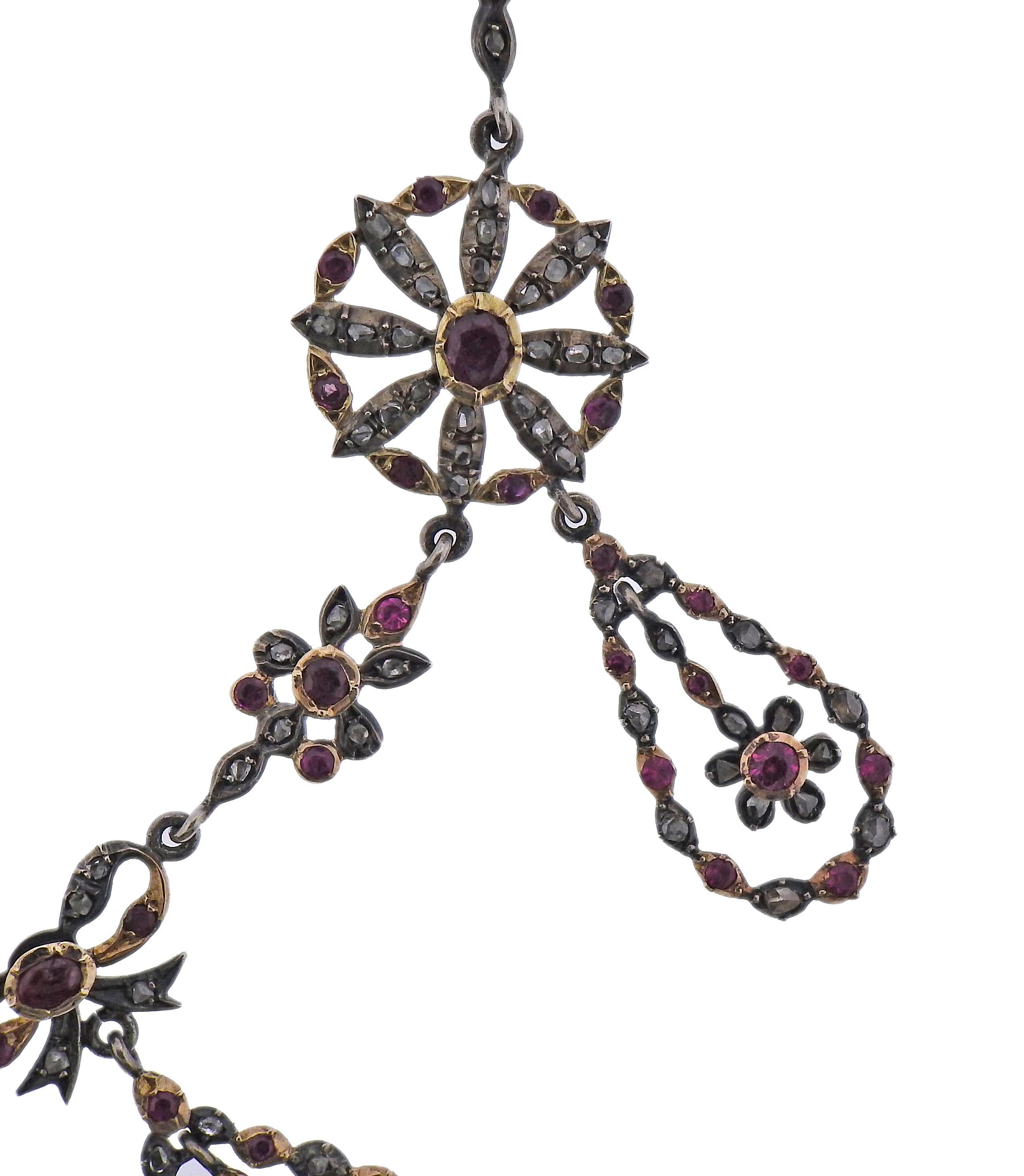 Antique Edwardian silver and 14k gold necklace, set with rubies and rose cut diamonds.  Necklace comes in box. Measures 19.5