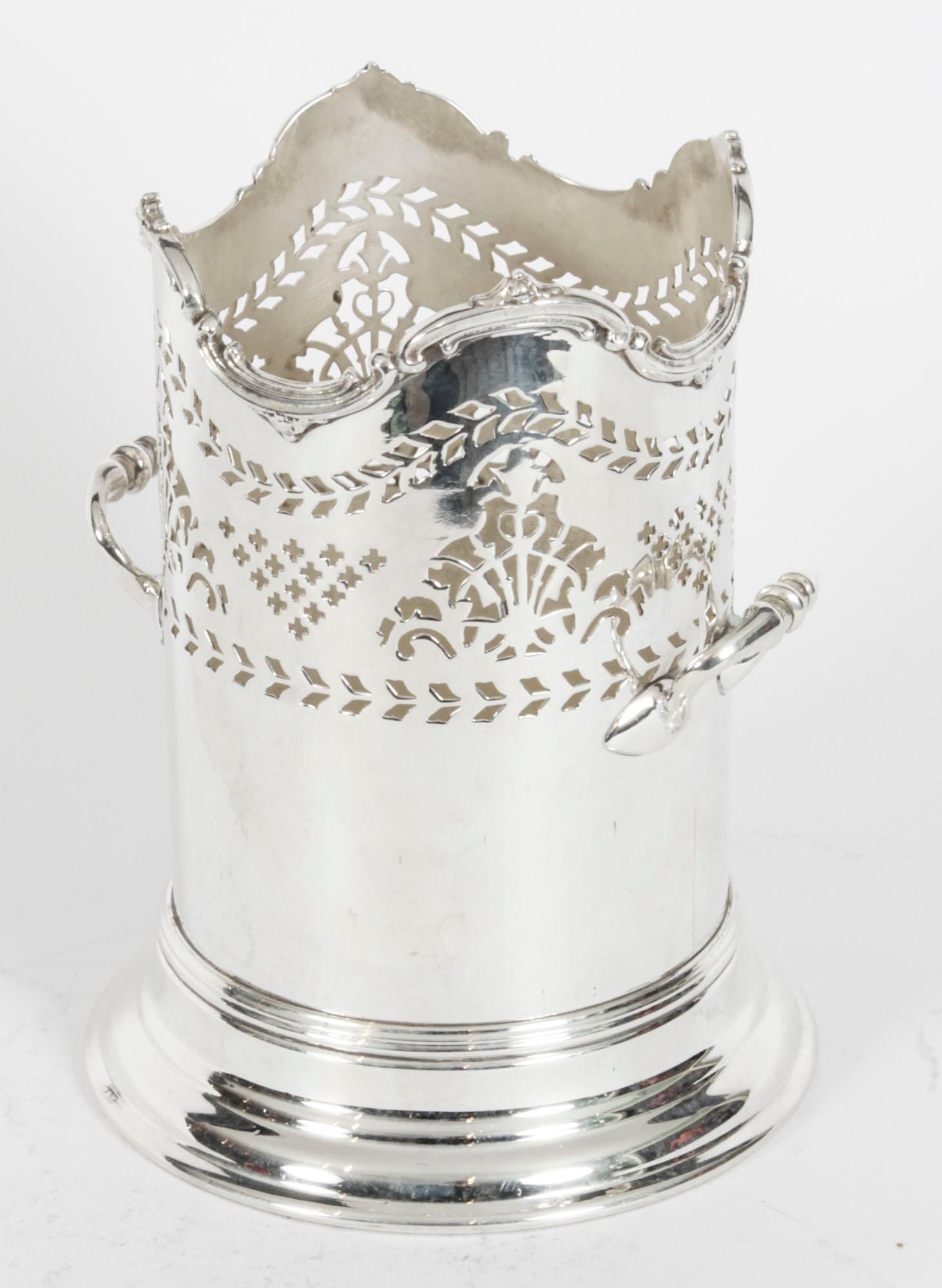 An attractive English antique silver plated bottle holder, circa 1880 and bearing the makers mark Henry Wilkinson Ltd.
 
The attention to detail exhibited by this silversmith is absolutely fantastic, with superb engraved and cut decoration.
