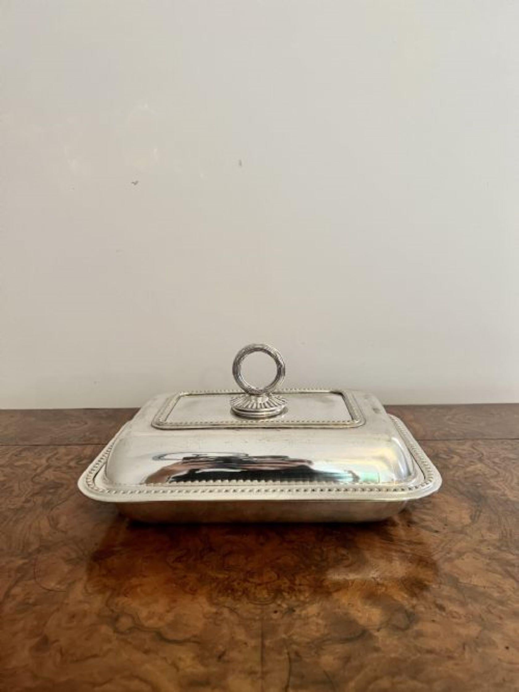 Antique Edwardian silver plated entree dish having a quality antique Edwardian silver plated entree dish, rectangular in shape with an ornate removable handle to the top and a removable lid.