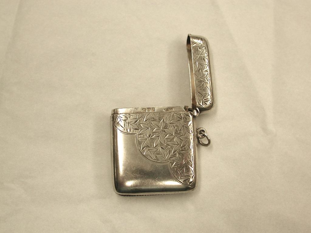 Antique Edwardian silver vesta case dated 1902, Henry Griffiths and Sons
Hallmarked in Chester, although the maker was based in Birmingham.
This vesta case has a good working spring so the top flips up with just a
flick of the thumb.
Originally