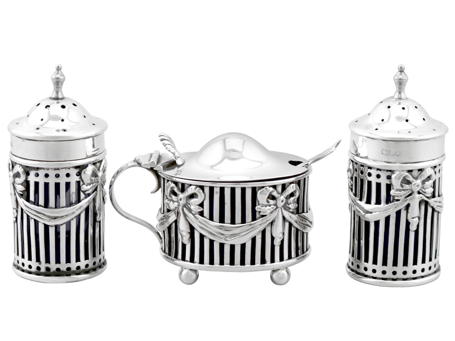 An exceptional, fine and impressive antique Edwardian English sterling silver and blue glass three piece condiment set - boxed; an addition to our dining silverware collection

This exceptional antique Edwardian English sterling silver condiment