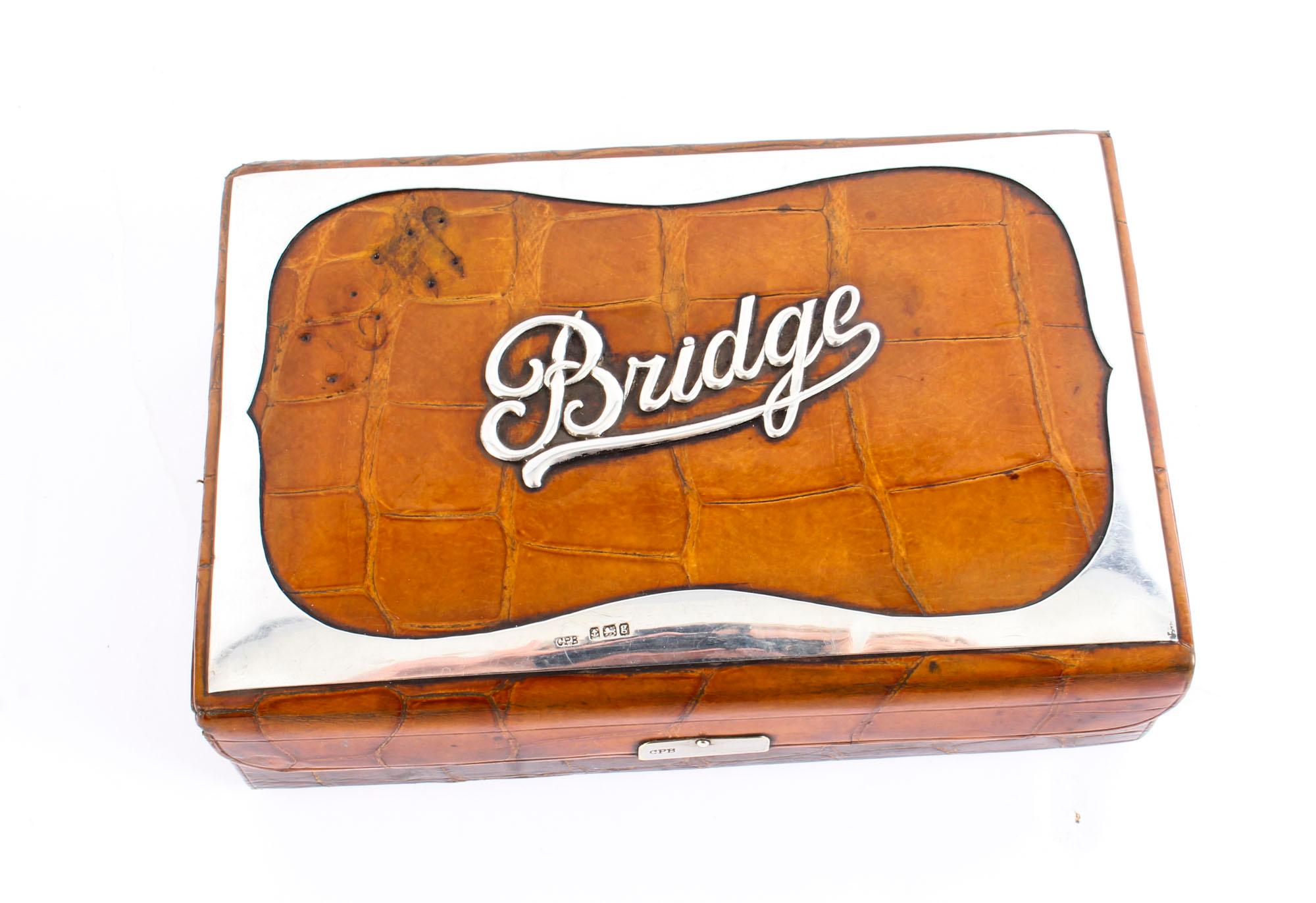 This is a superb antique Edwardian genuine crocodile leather bridge box with luxurious sterling silver mounts which are hallmarked for Birmingham 1906 with the makers' mark for Charles Penny Brown.

This elegant bridge box is rectangular in shape