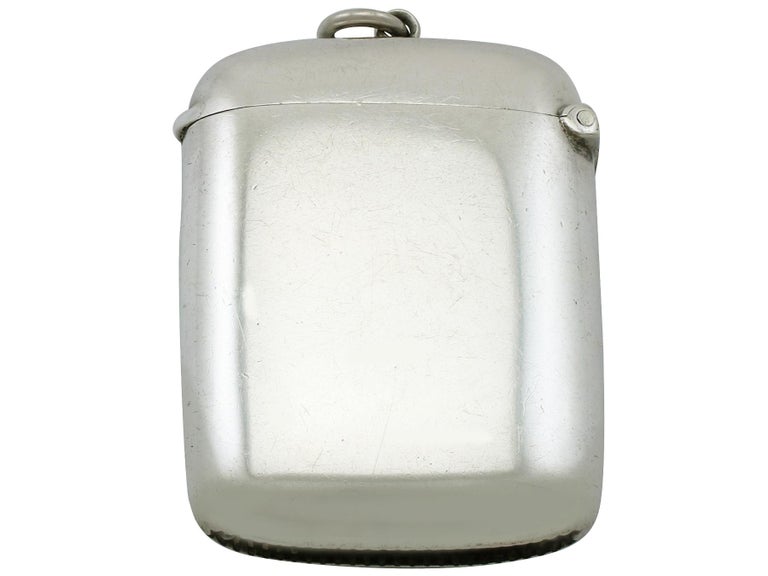 An exceptional, fine and impressive antique Edwardian sterling silver and enamel vesta case; an addition to our enamel and silverware collection

This antique Edwardian sterling silver vesta case has a plain rectangular rounded form.

The