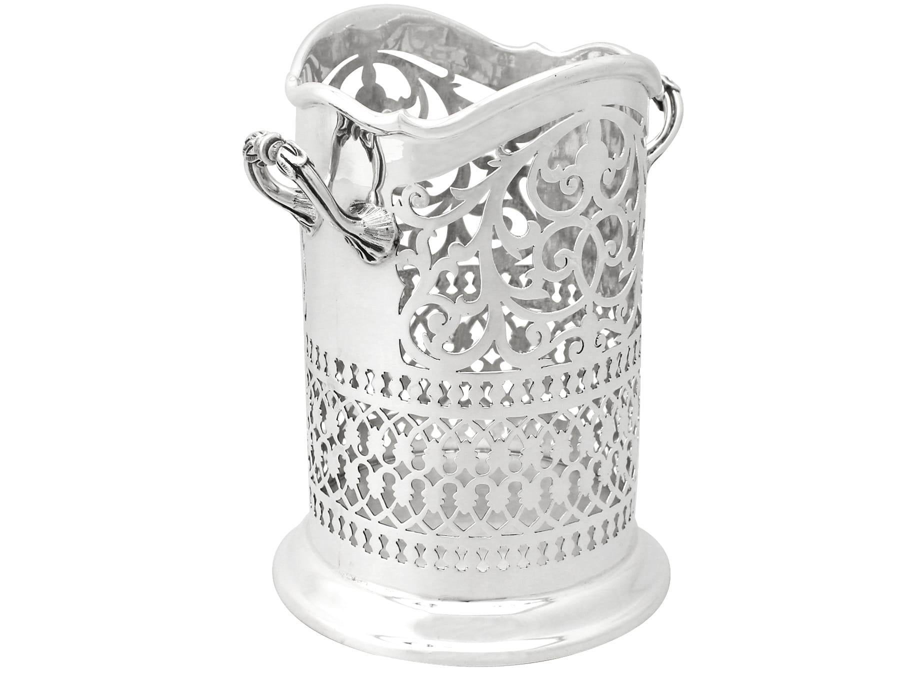 An exceptional, fine and impressive antique Edwardian English sterling 925 standard solid silver bottle coaster; an addition to our ornamental silverware collection.

This exceptional antique Edwardian sterling standard solid silver bottle coaster