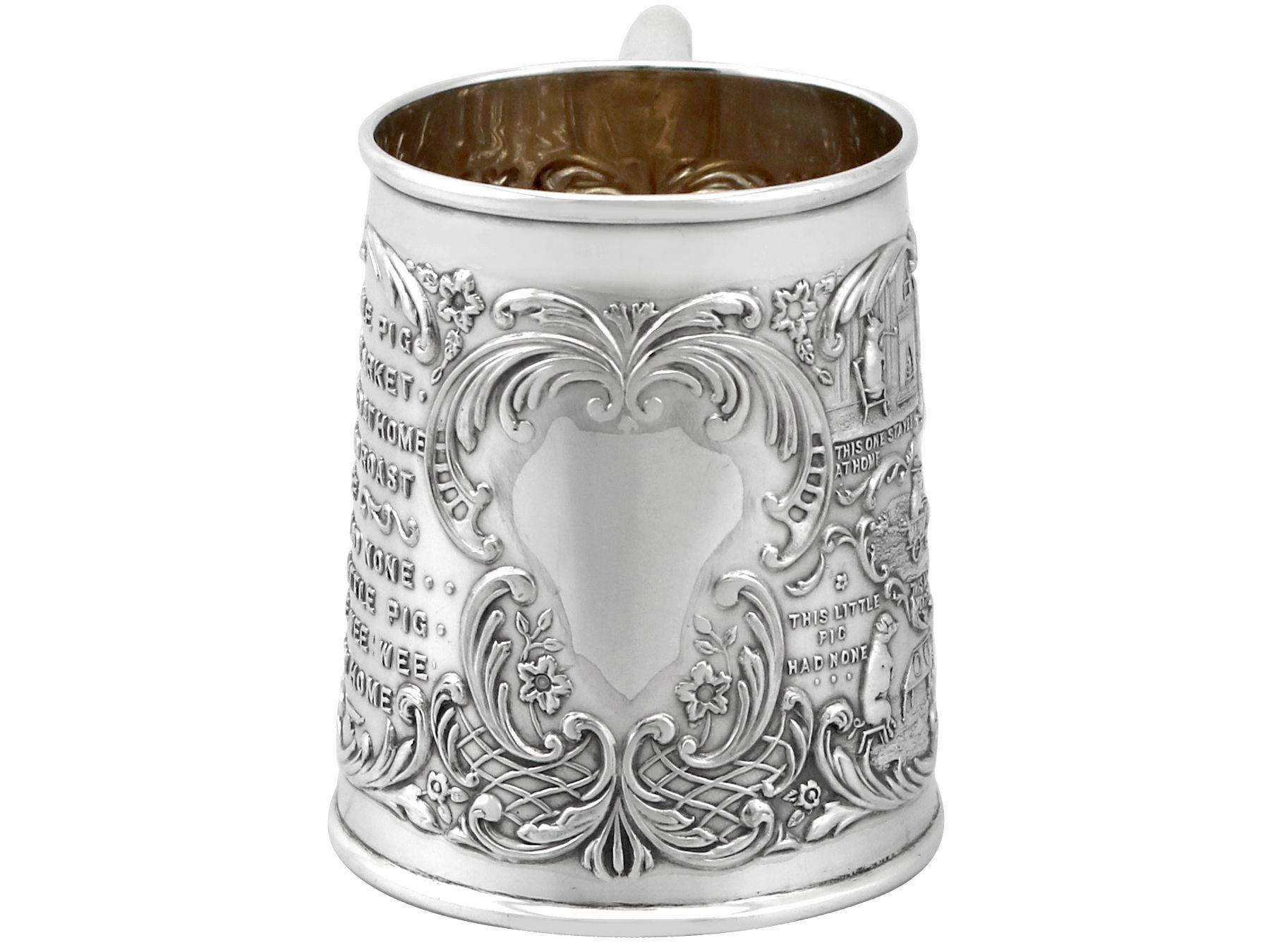 An exceptional, fine and impressive antique Edwardian English sterling silver christening mug; an addition to our silver presentation collection.

This exceptional antique Edwardian sterling silver christening mug has a tapering cylindrical
