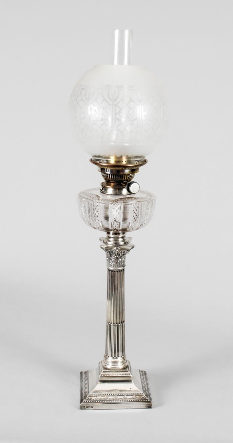 This is an impressive large antique Edwardian sterling silver Corinthian column table lamp bearing hallmarks for Sheffield 1904 and the makers mark of the renowned silversmith Hawksworth, Eyre & Co Ltd

It features a classic Corinthian Capital