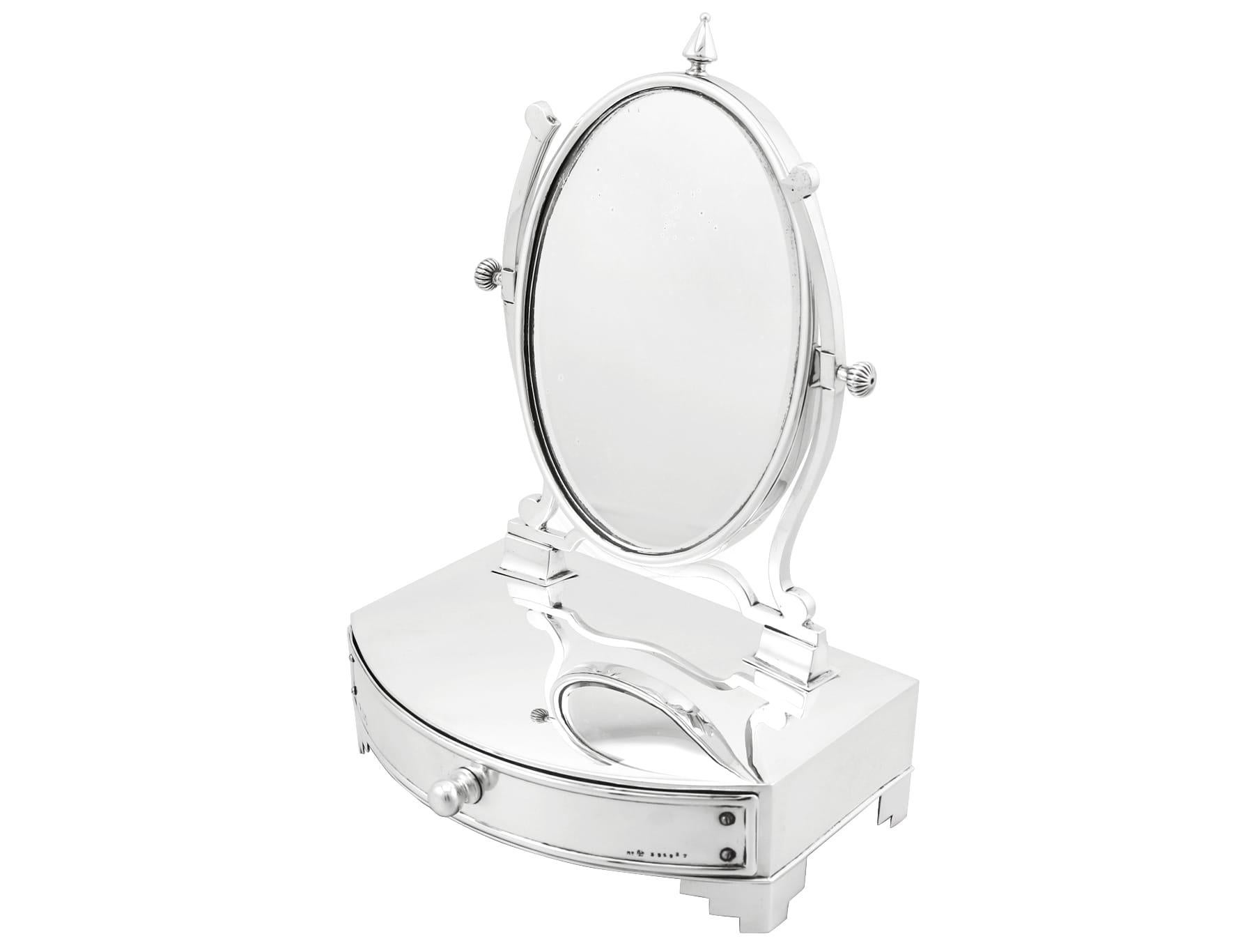 An exceptional, rare antique Edwardian English sterling silver dressing cheval table mirror and jewelry box; an addition to the ornamental silverware collection

This exceptional and rare antique sterling silver jewelry box with mirror has a