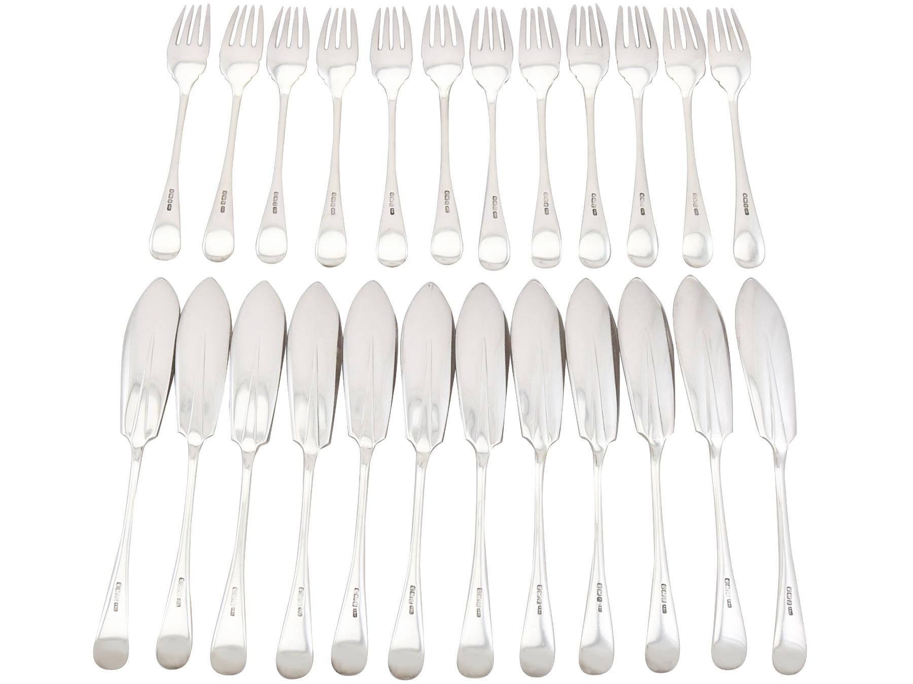 An exceptional, fine and impressive antique Edwardian English sterling silver bright-cut Old English Rat Tail pattern fish cutlery set for twelve persons; an addition to our dining silverware collection.

This exceptional antique Edwardian
