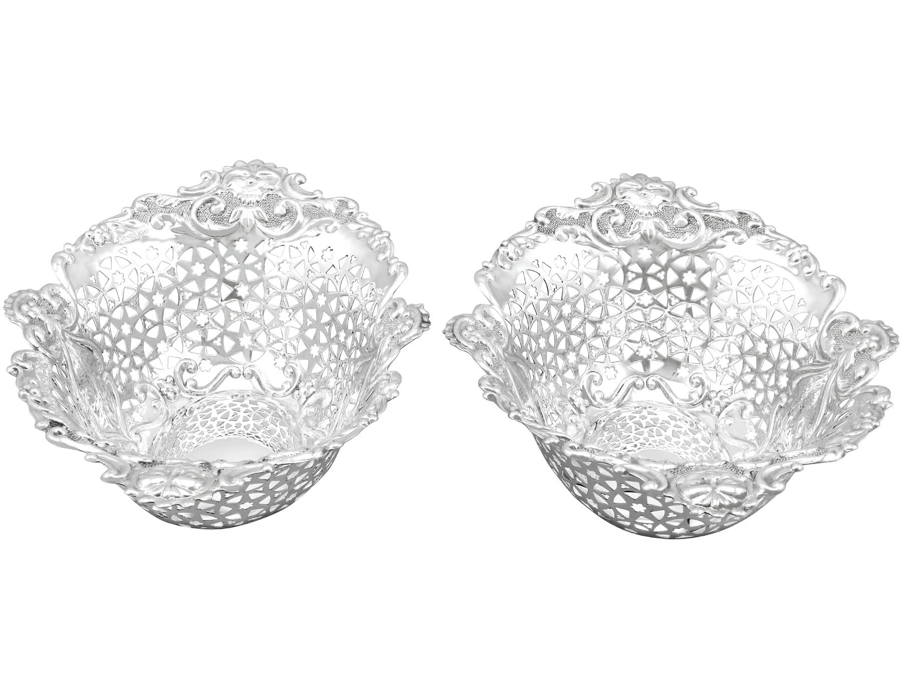 An exceptional, fine and impressive pair of antique Edwardian English sterling silver dishes; an addition to our silver tableware collection.

These exceptional antique silver dishes, in sterling standard, have an oval rounded form.

The surfaces of