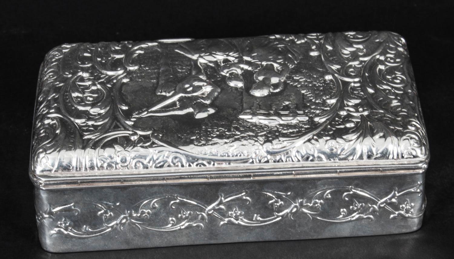 This is a lovely antique Edwardian sterling silver jewellery casket bearing the makers mark of H.Matthews, and hallmarks for Birmingham, 1901.

The rectangular hinged box cover is chased with figures in 18th century dress within a cartouche