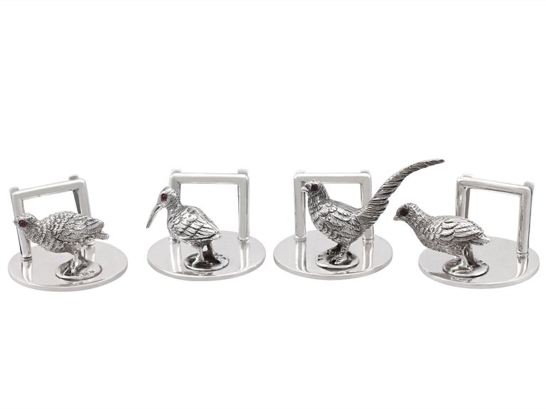 An exceptional, fine and impressive set of four antique Edwardian English sterling silver menu / card holders - boxed; an addition to our diverse dining silverware collection.

These exceptional antique Edwardian sterling silver menu holders have