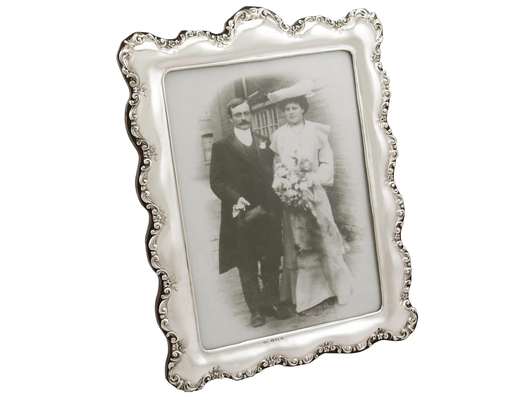 An exceptional, fine and impressive pair of antique George V English sterling silver photograph frame; an addition to our silver mounted glass collection.

These exceptional antique Edwardian English sterling silver photograph frames have a