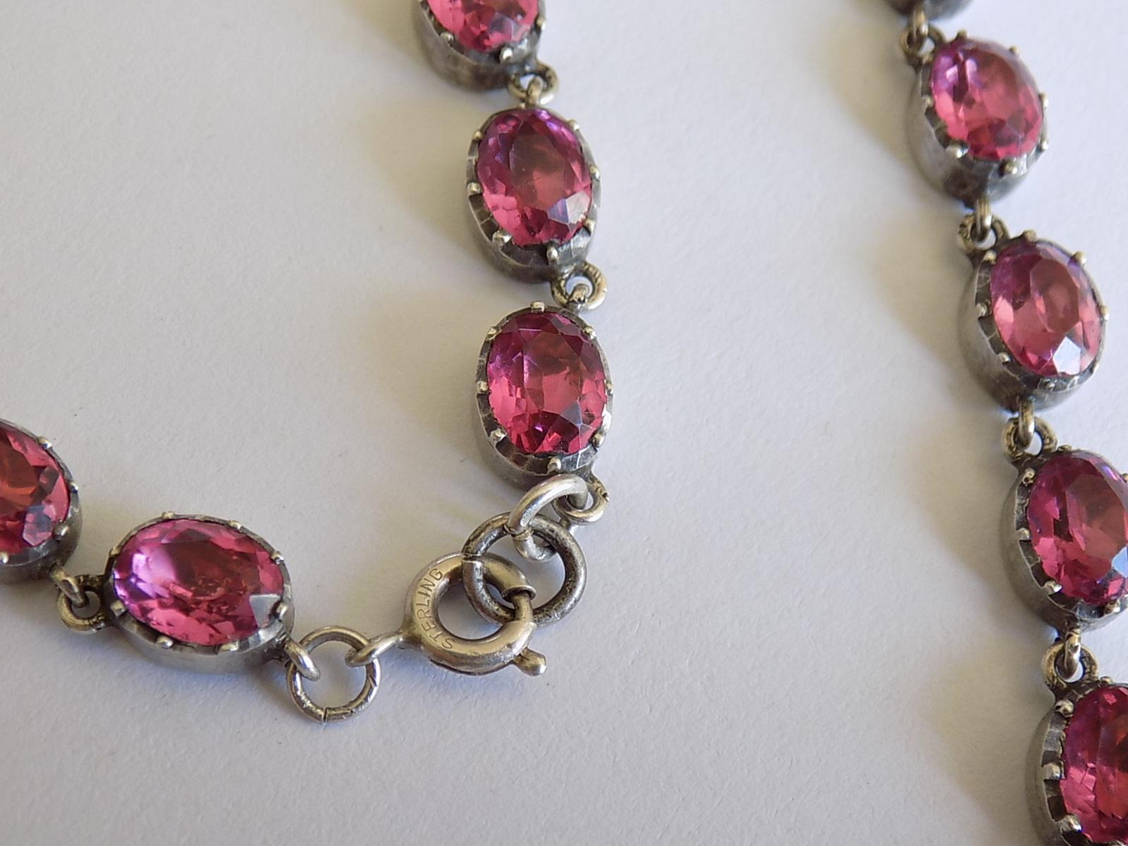 A Gorgeous Edwardian c.1900 Sterling Silver and Pink Paste (glass) Riviere necklace. The Paste in foiled closed back setting. English origin.
Marked: Sterling.
Length 40cm or 15.75
