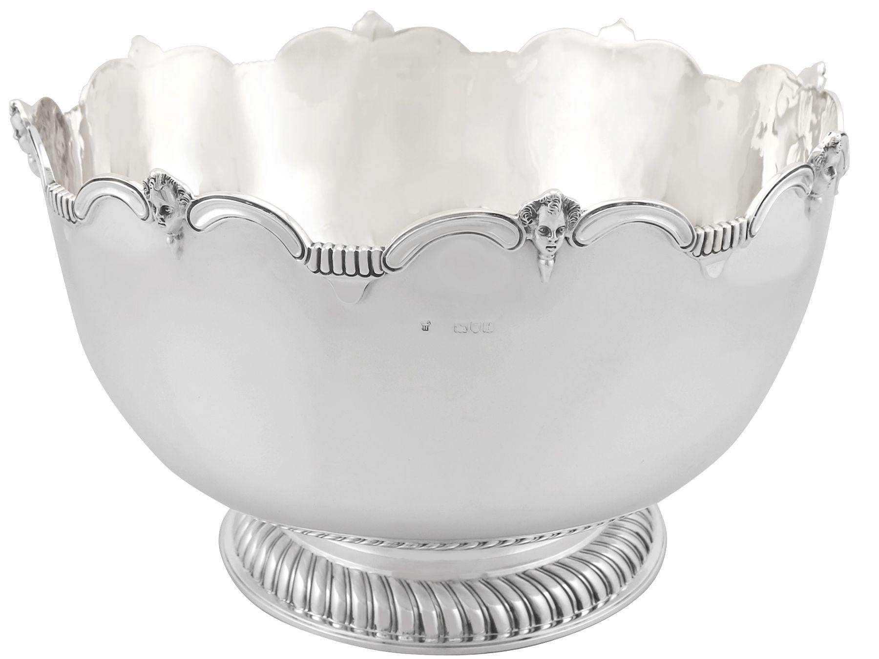 A magnificent, fine and impressive, antique Edwardian English sterling silver Monteith style presentation bowl; an addition to our ornamental silverware collection.

This magnificent, fine and impressive antique Monteith style Edwardian silver