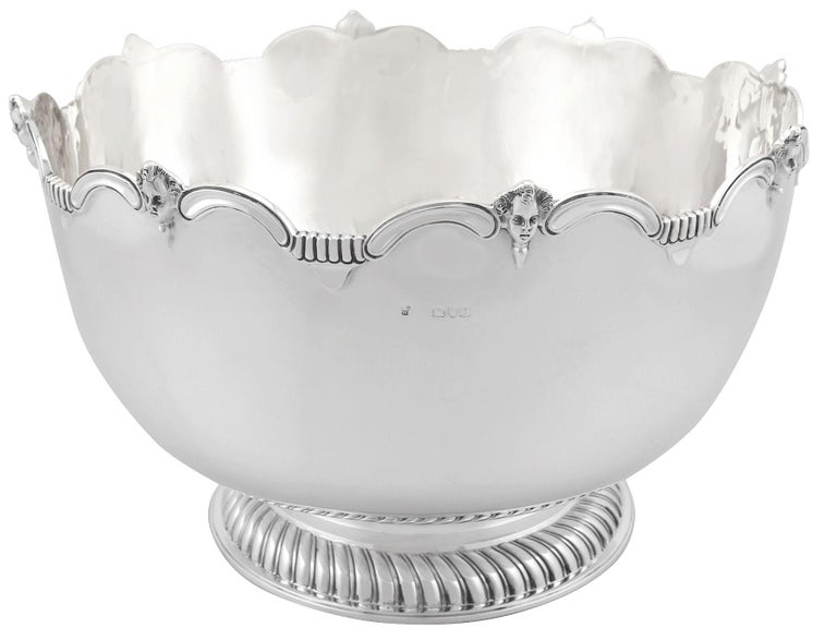 A magnificent, fine and impressive, antique Edwardian English sterling silver Monteith style presentation bowl; an addition to our ornamental silverware collection.

This magnificent, fine and impressive antique Monteith style Edwardian silver