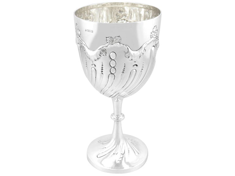 An exceptional, fine and impressive antique Edwardian English sterling silver presentation cup; an addition to our presentation silverware collection

This exceptional antique Edwardian sterling silver cup has a plain circular bell shaped form to