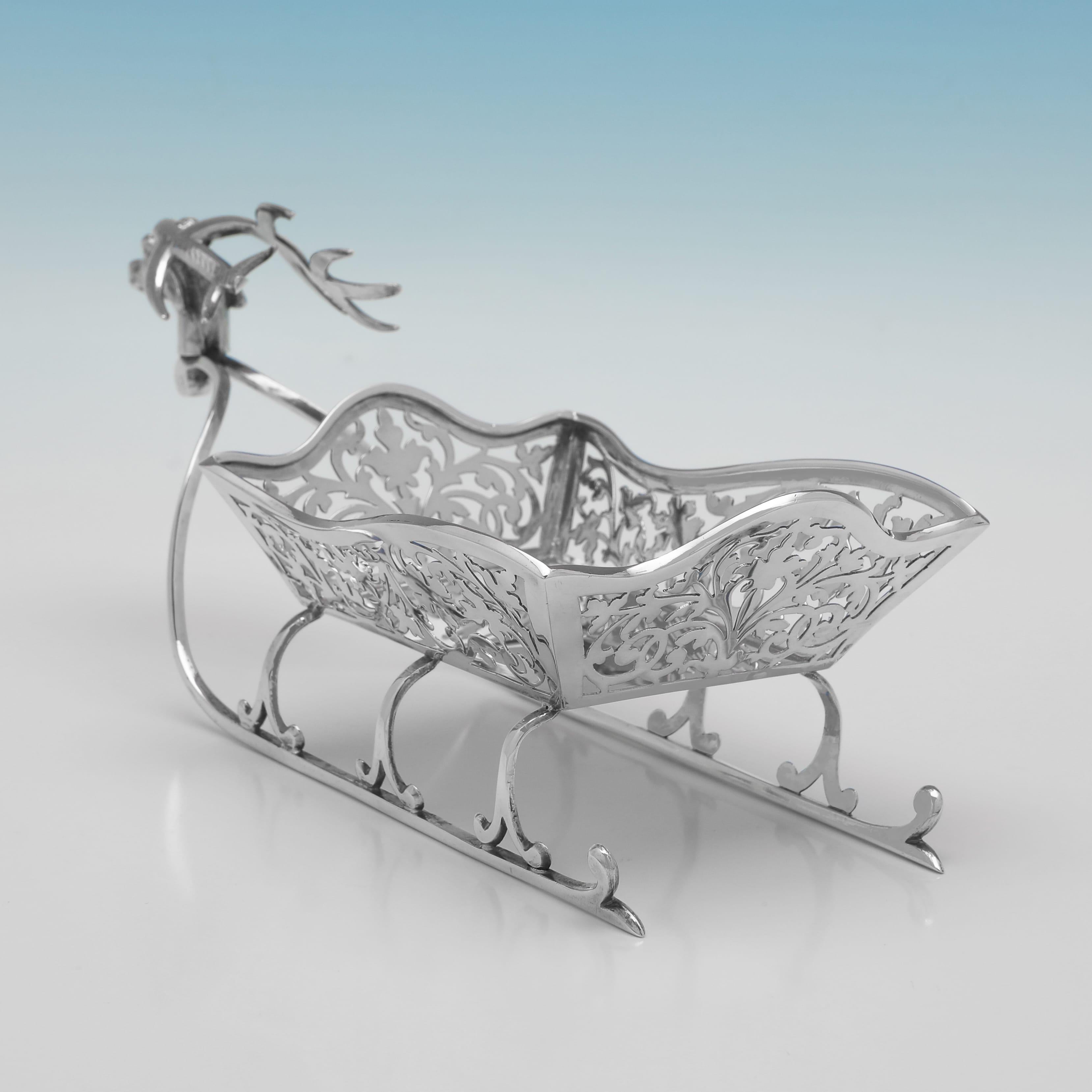 Hallmarked in London in 1908, this charming, Edwardian, Antique Sterling Silver Bonbon Dish, is modelled as a sleigh, with pierced decoration to the sides. The dish measures 4